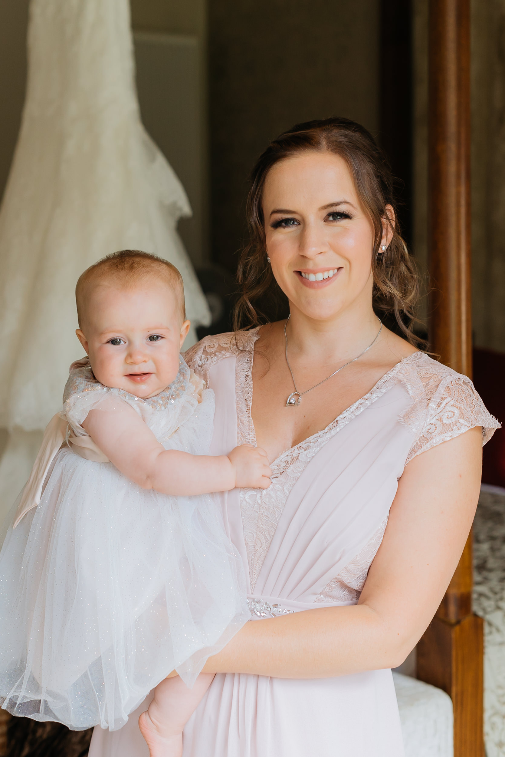 portrait of the bridesmaid and her baby