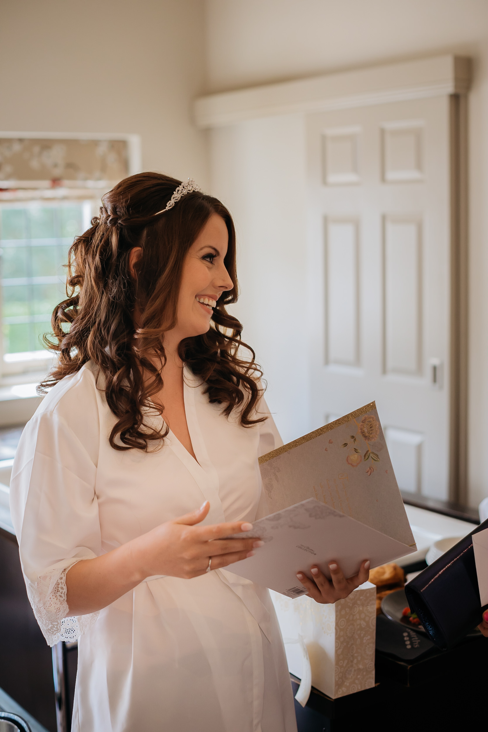 The bride sharing a joke with her bridesmaids