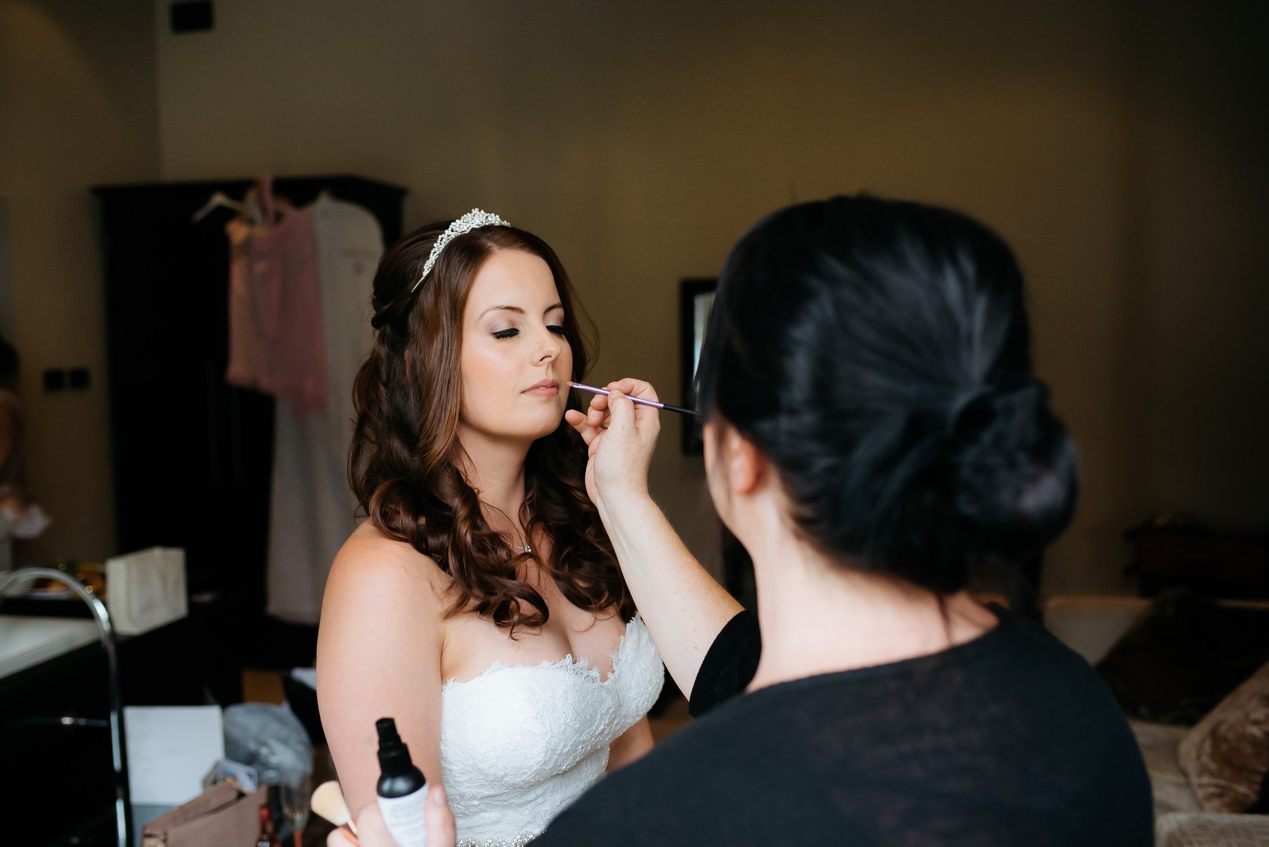 Final makeup touch ups before going to the ceremony