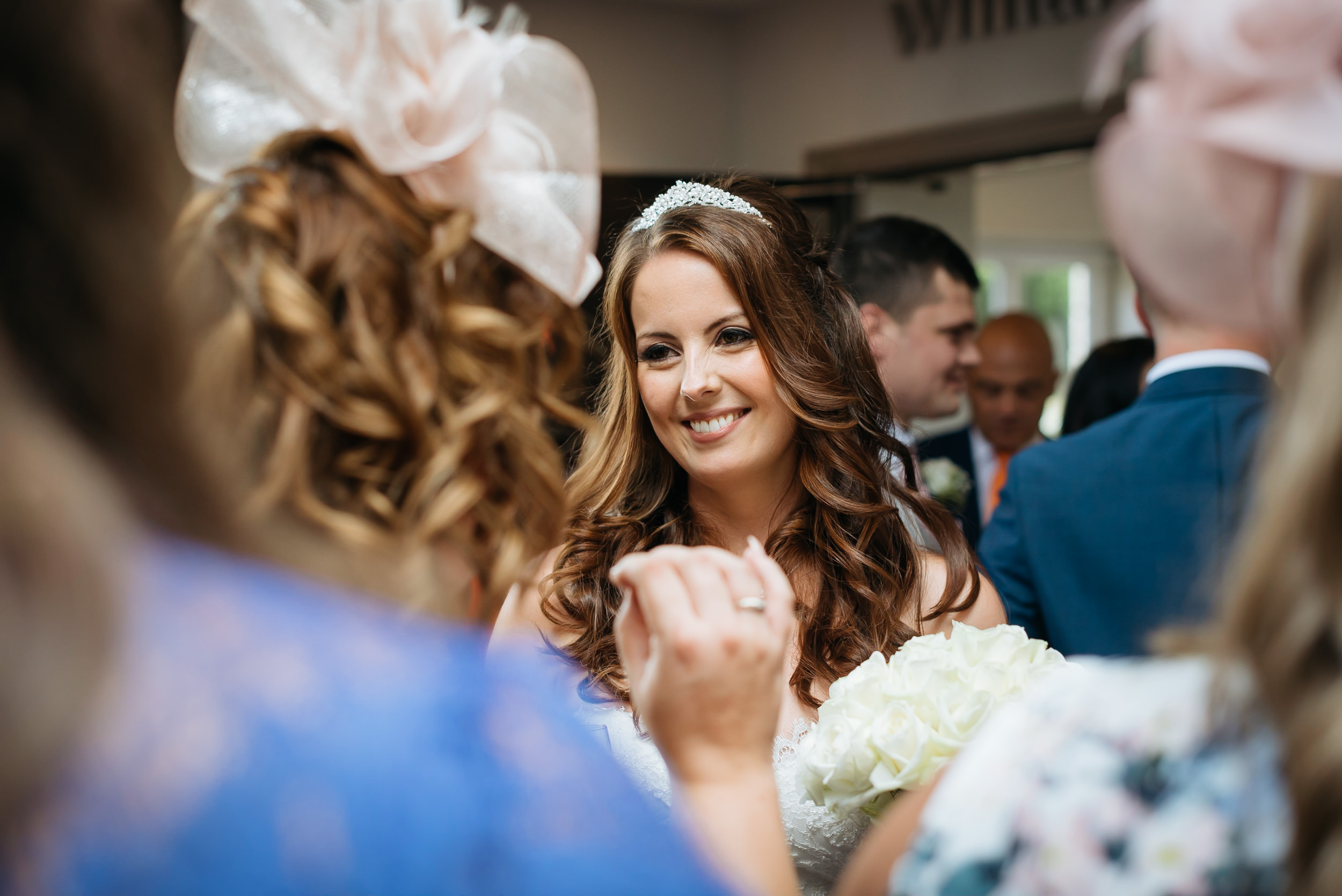 bride is talking with wedding guests