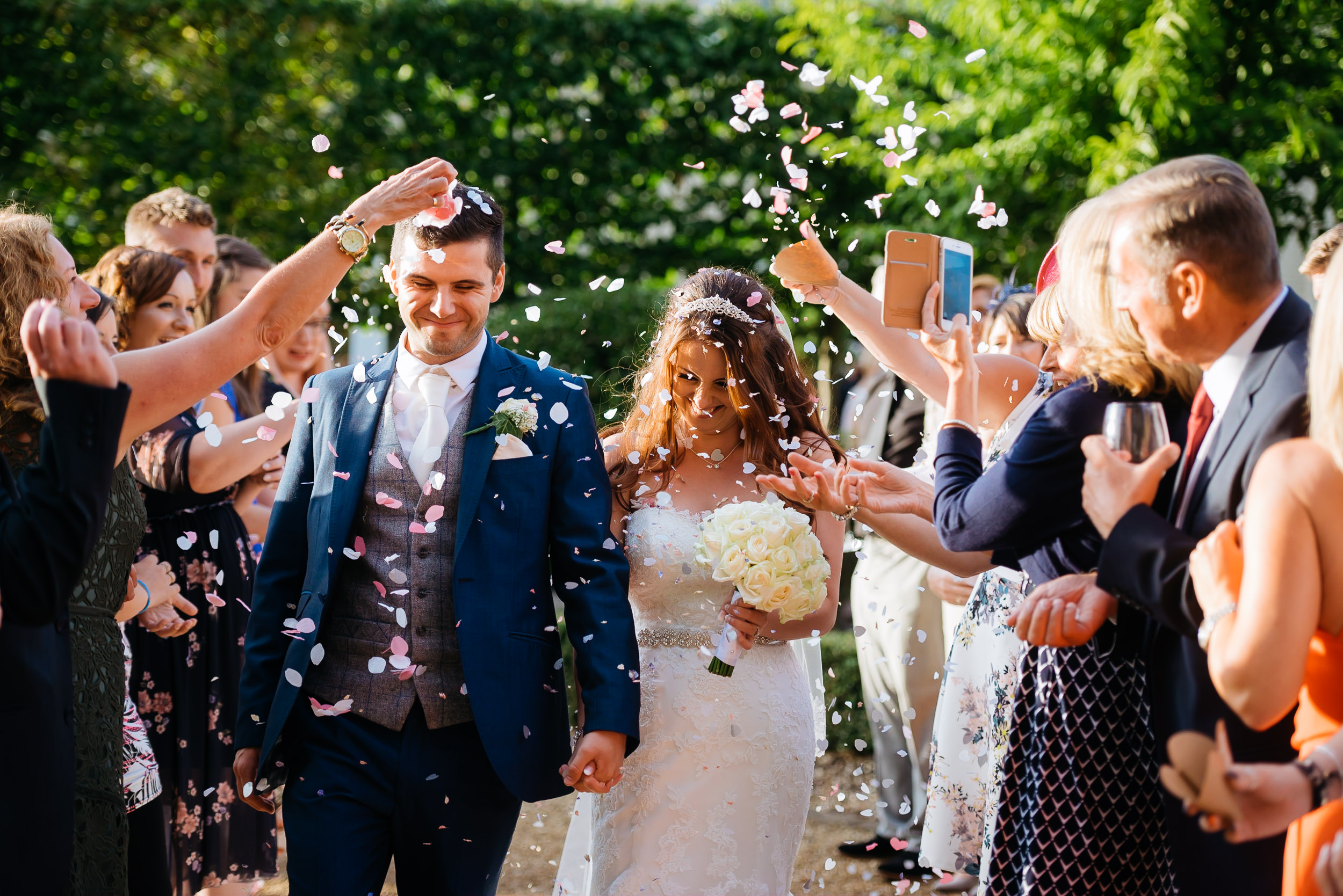 throwing confetti on the happy couple