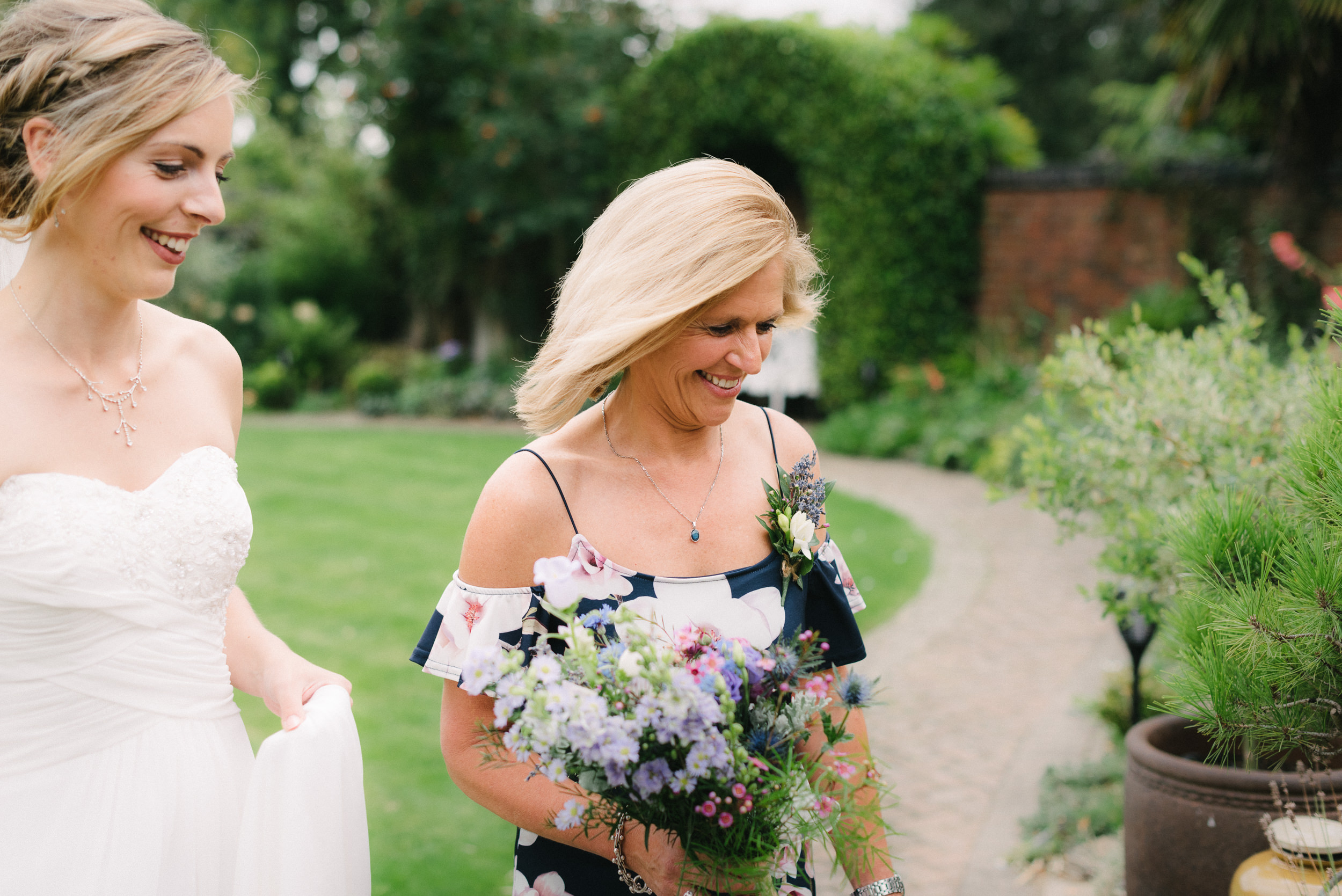 Bride and her mother smiling