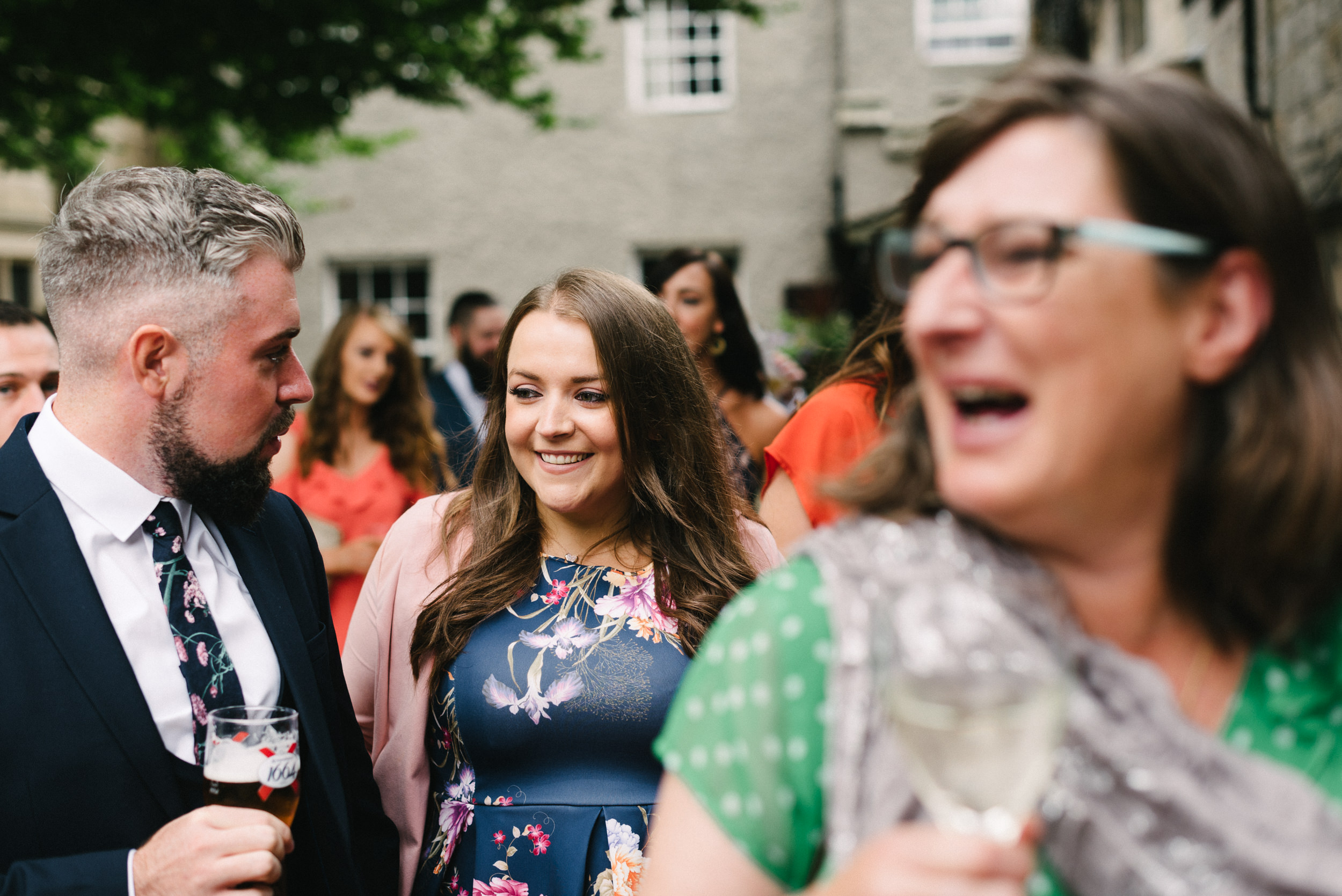 Wedding guests arriving for the ceremony at Risley Hall