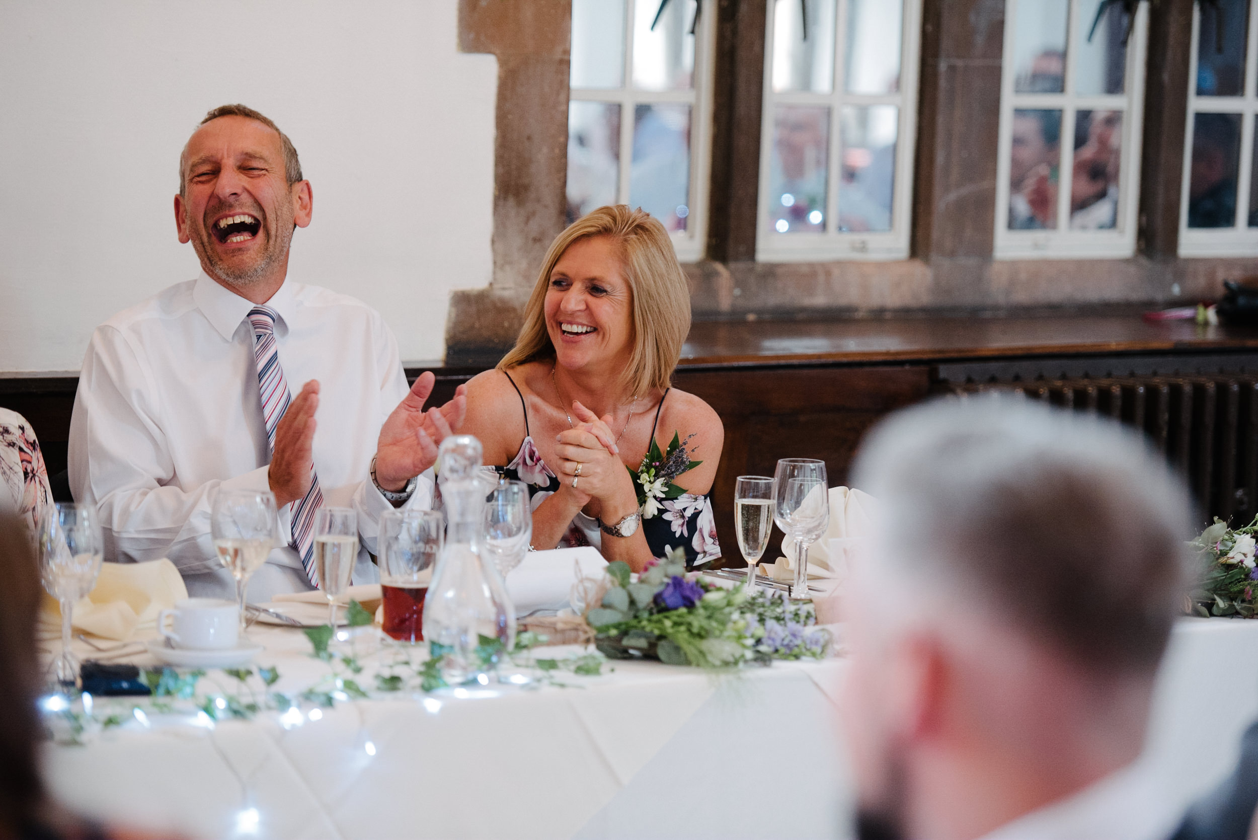Brides mother laughing at the grooms speech
