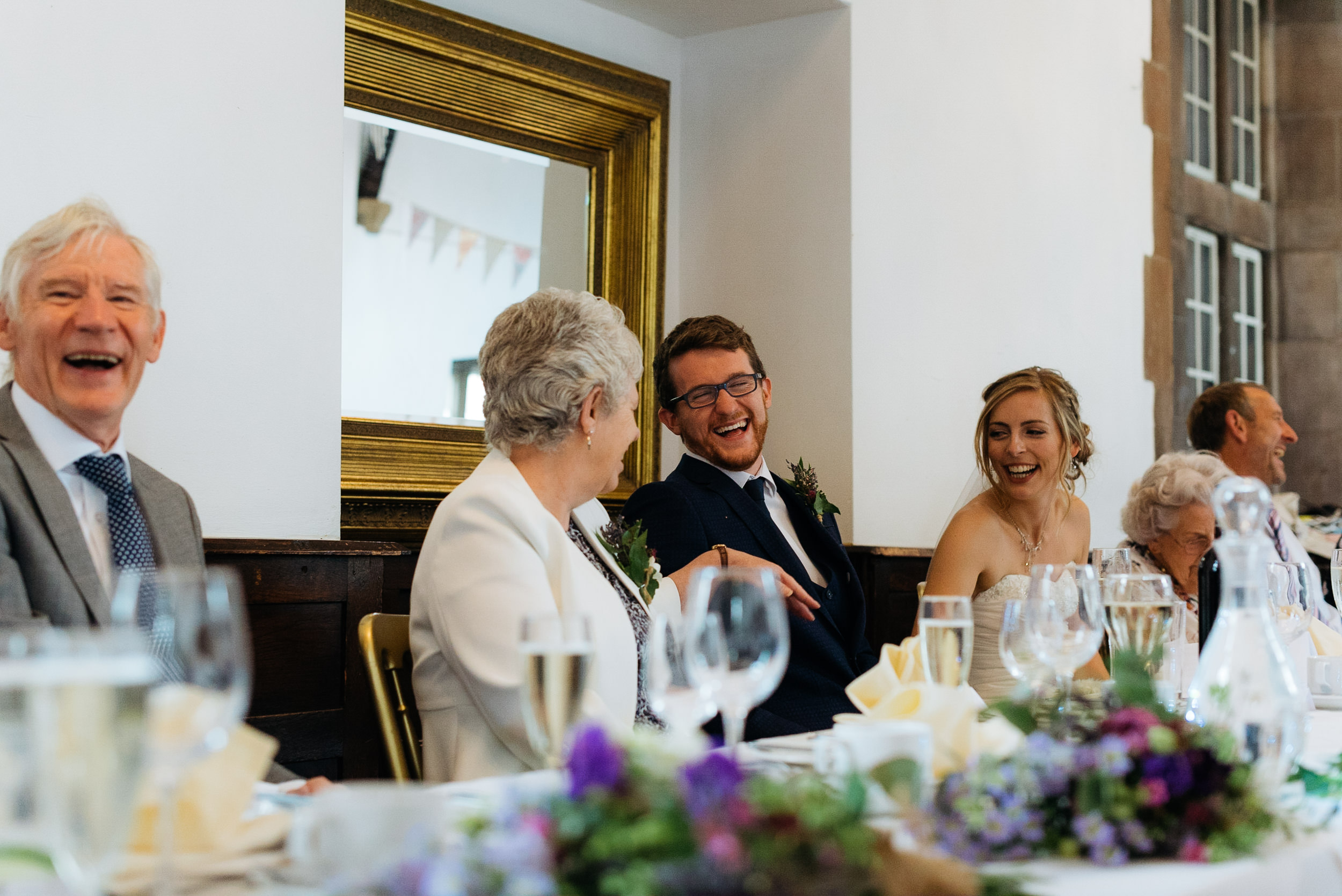 Grooms mother and father enjoying the speeches