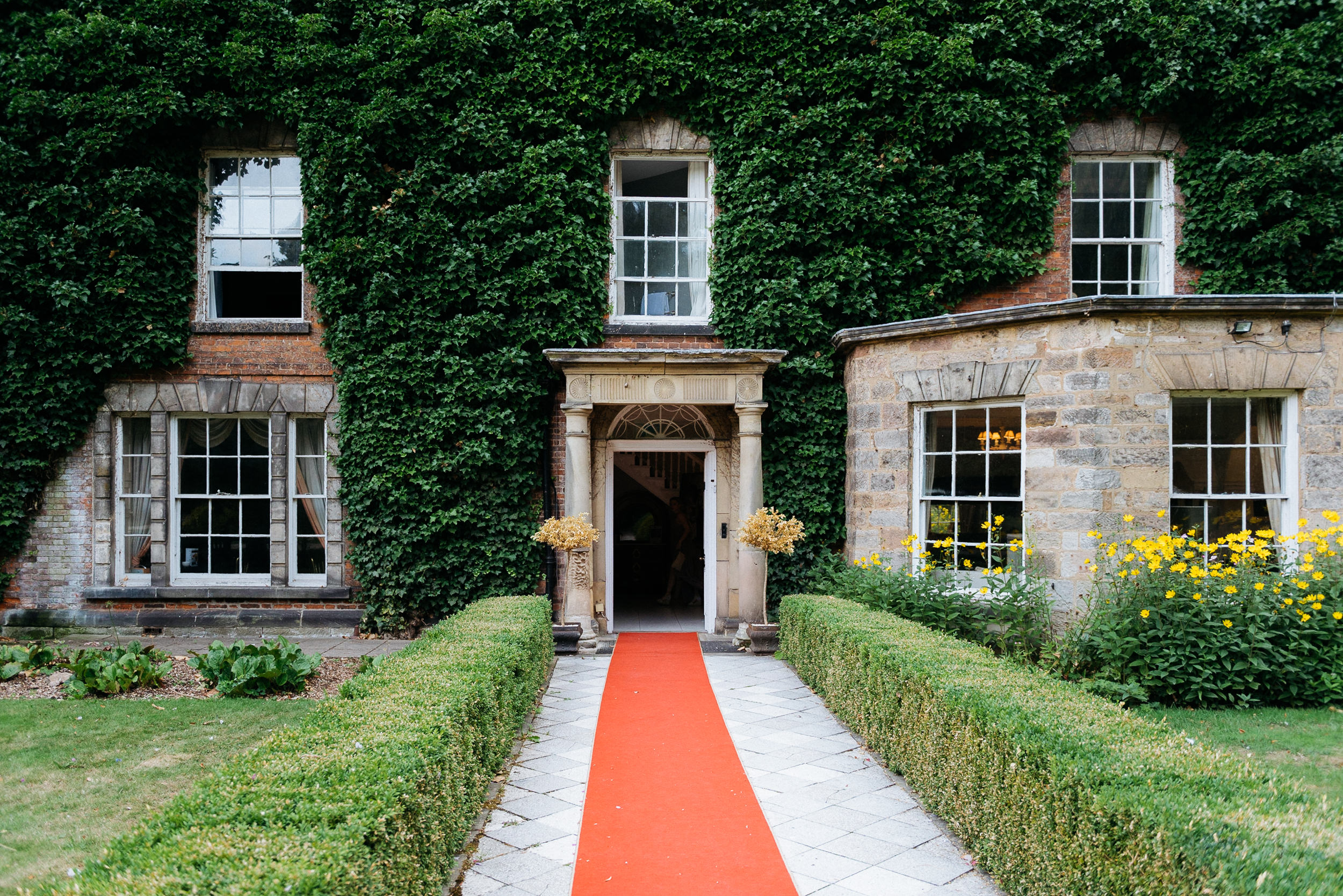 Red carpet at Risley Hall wedding