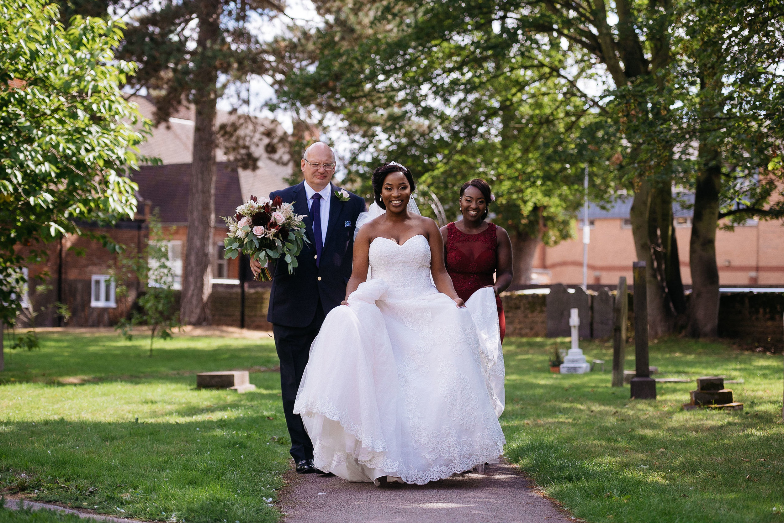 bride and her father walking to church on their wedding day at Colwick Hall