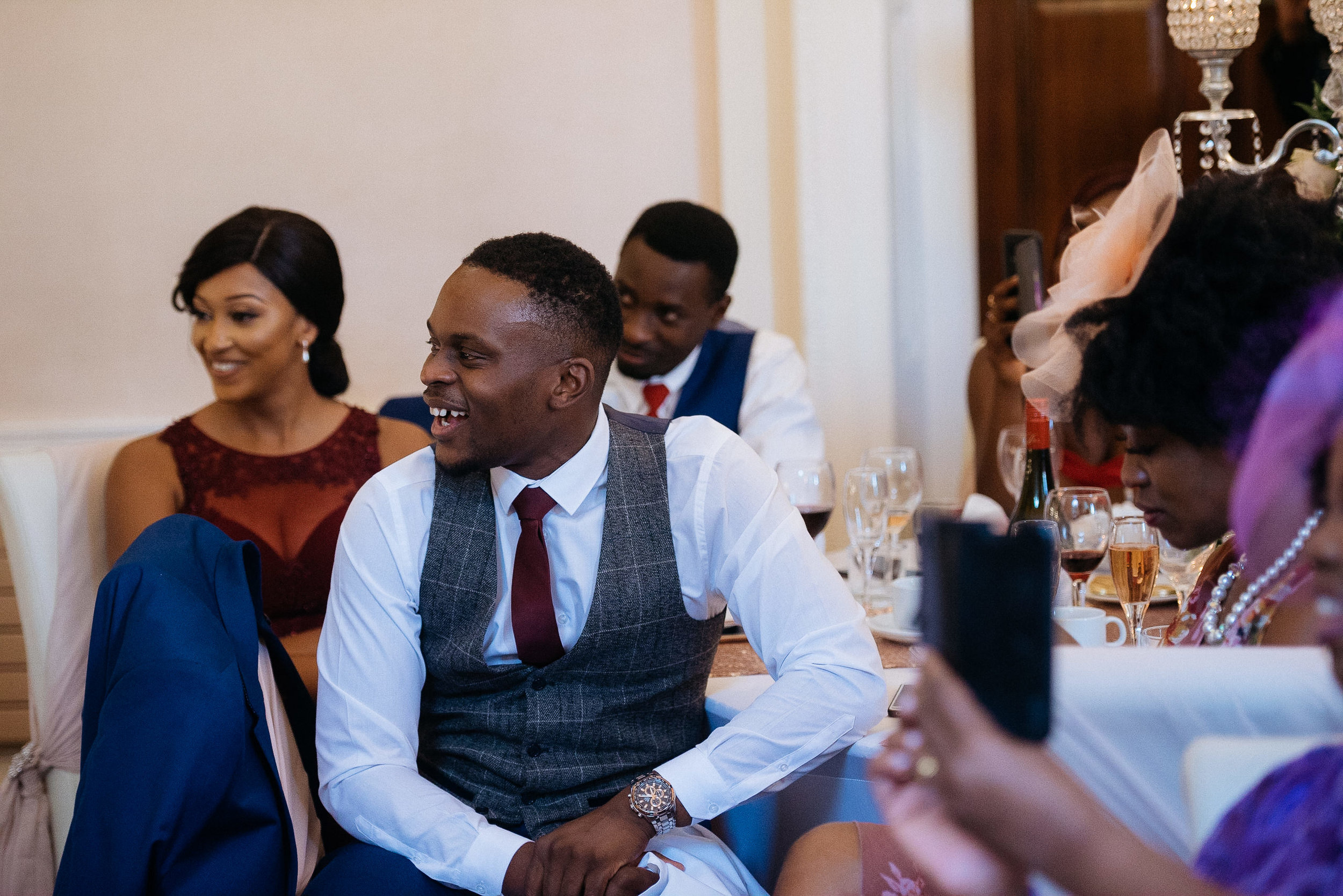 Guests having fun during the wedding speeches