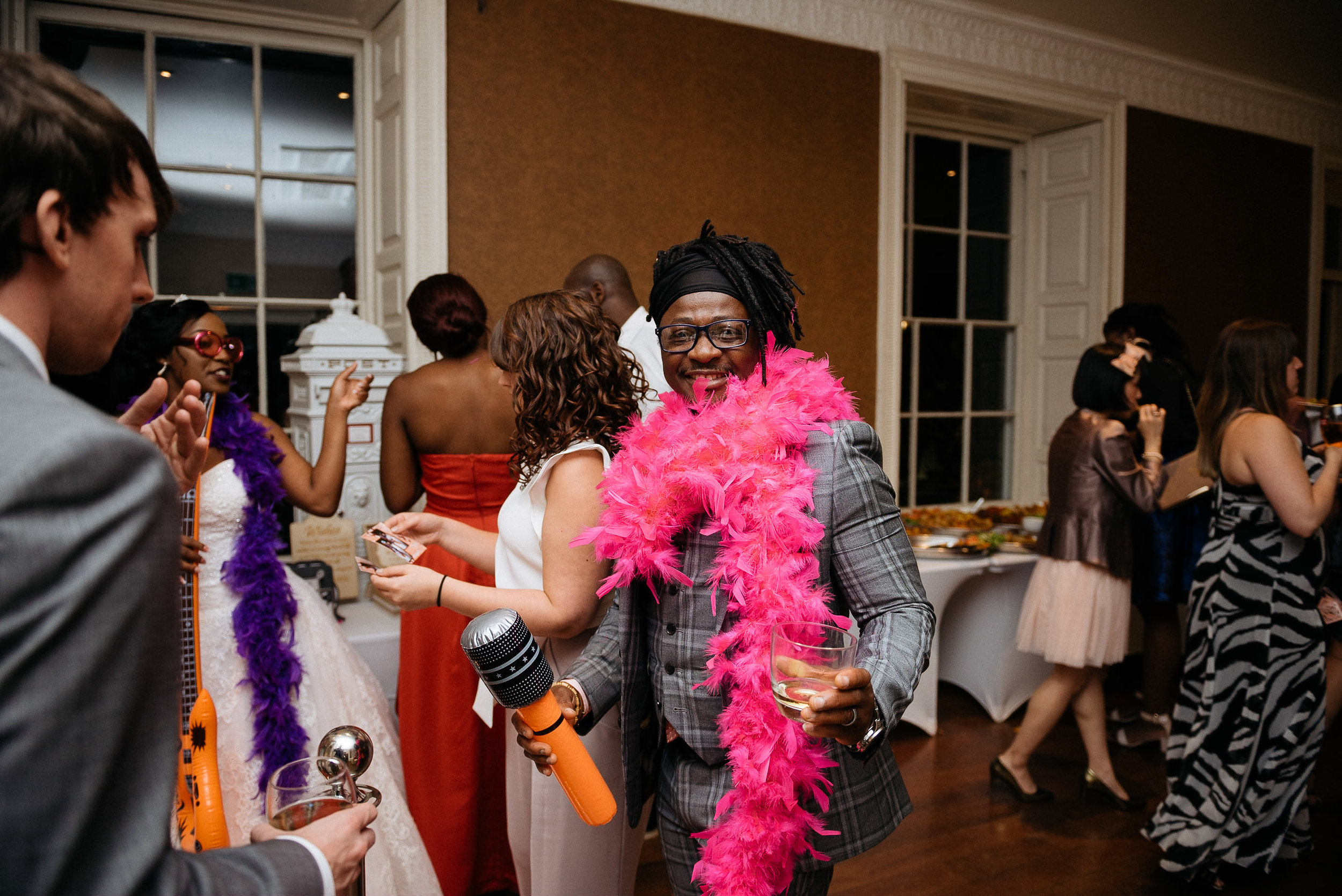 Wedding guests dress up for the photo booth