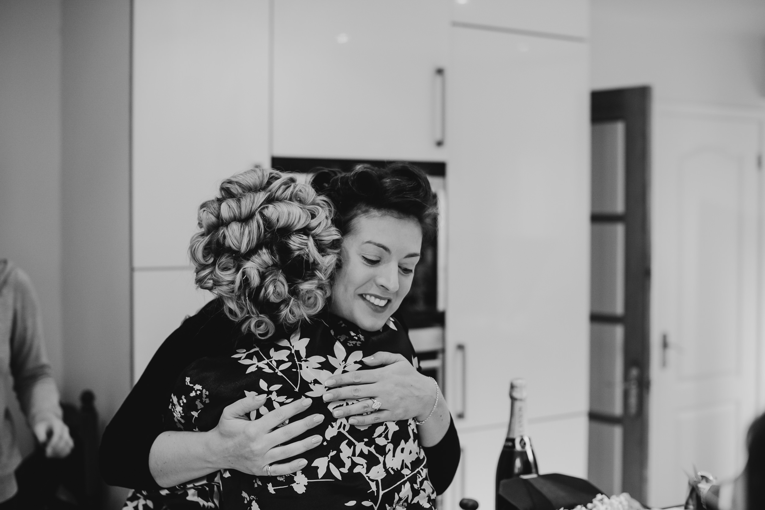 Bride hugging black and white photo