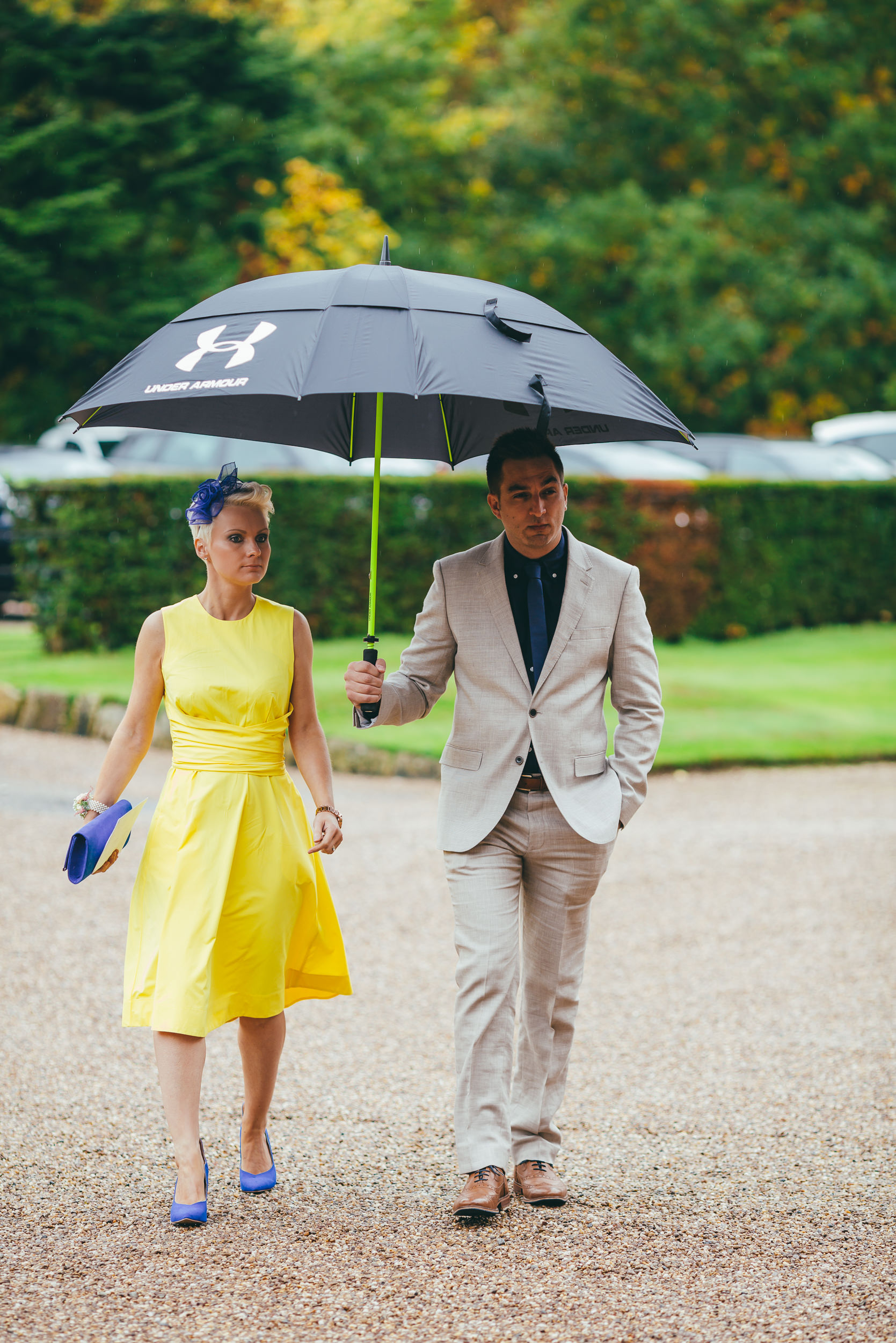 Wedding guests in the rain at Norwood Park