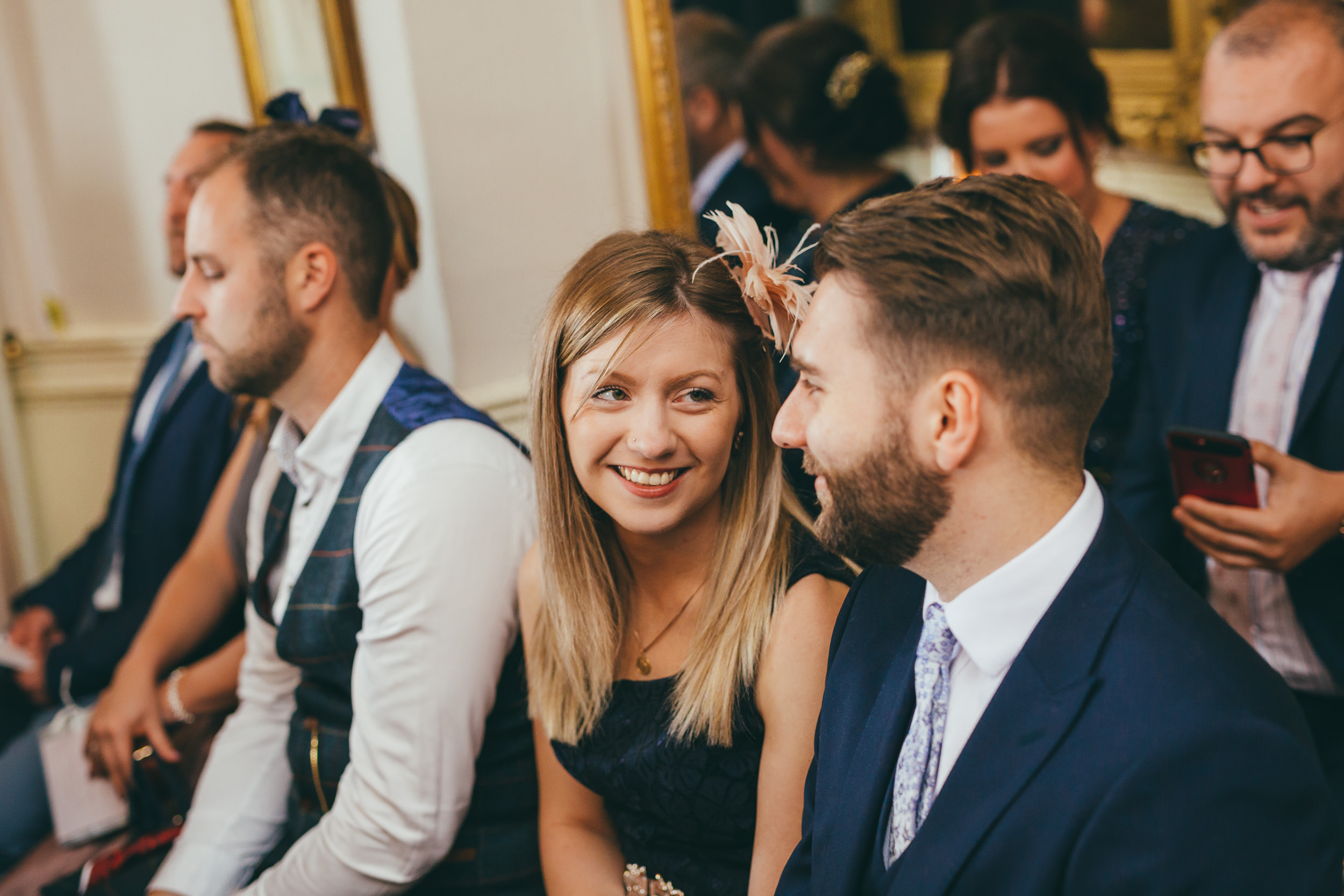 Girl smiling during wedding ceremony at Norwood Park