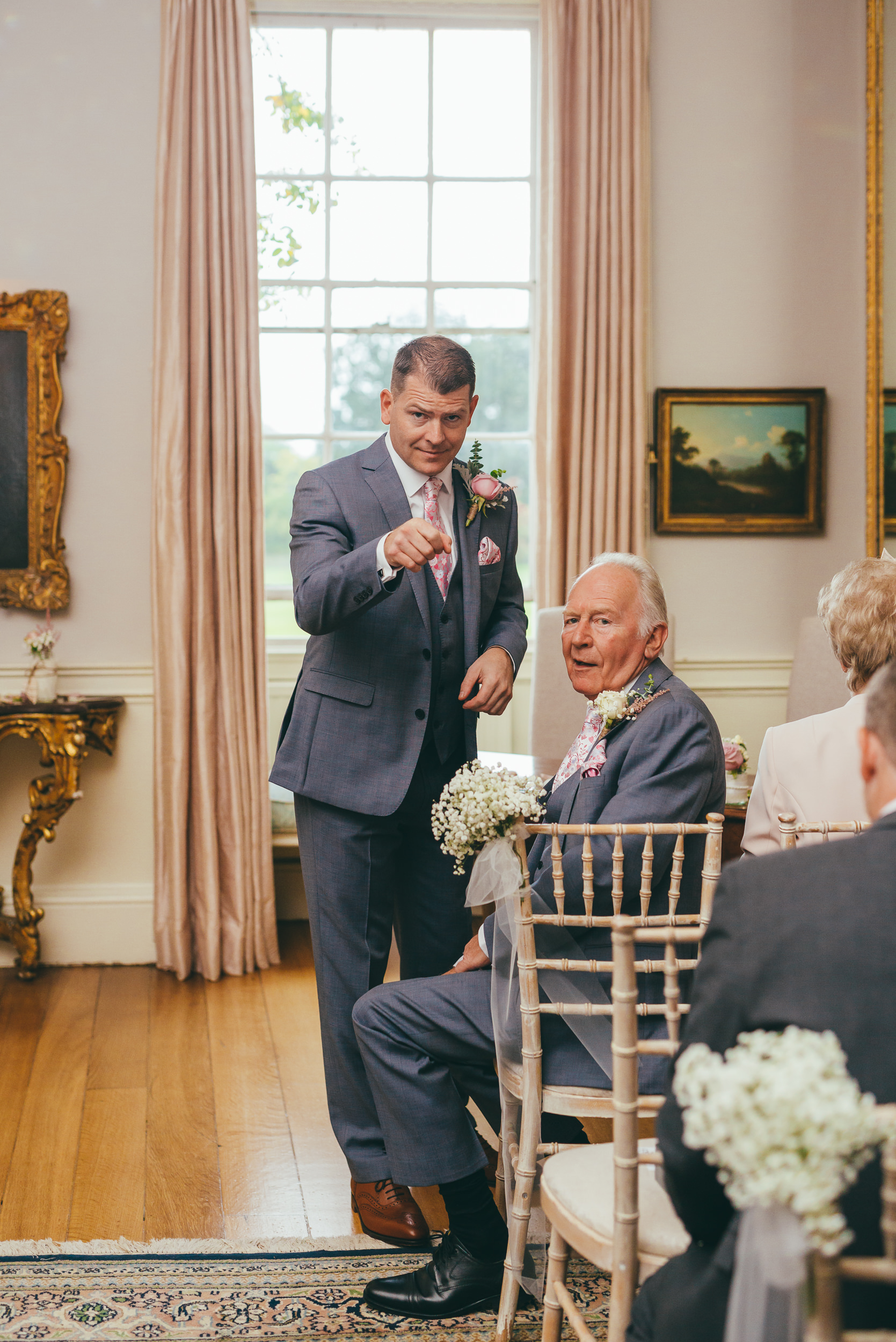 Groom pointing