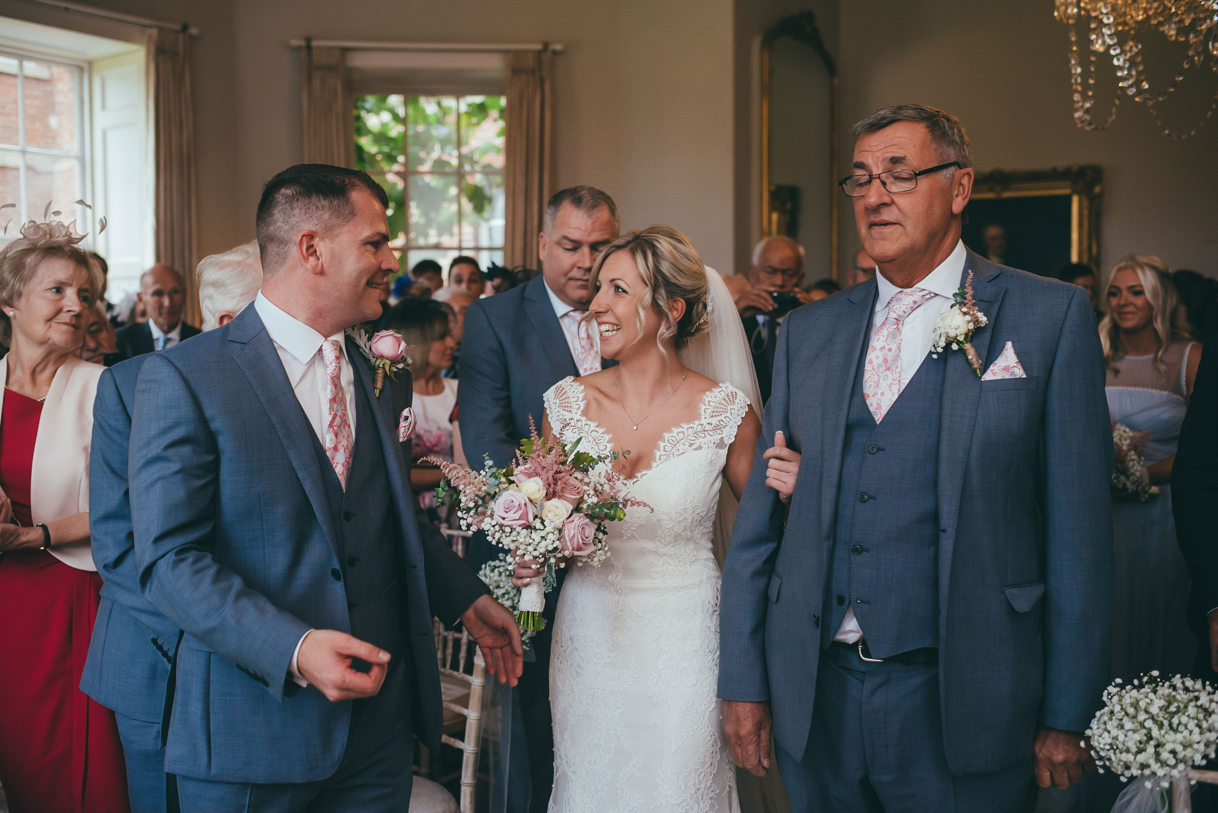 Bride smiling at her husband during the wedding ceremony