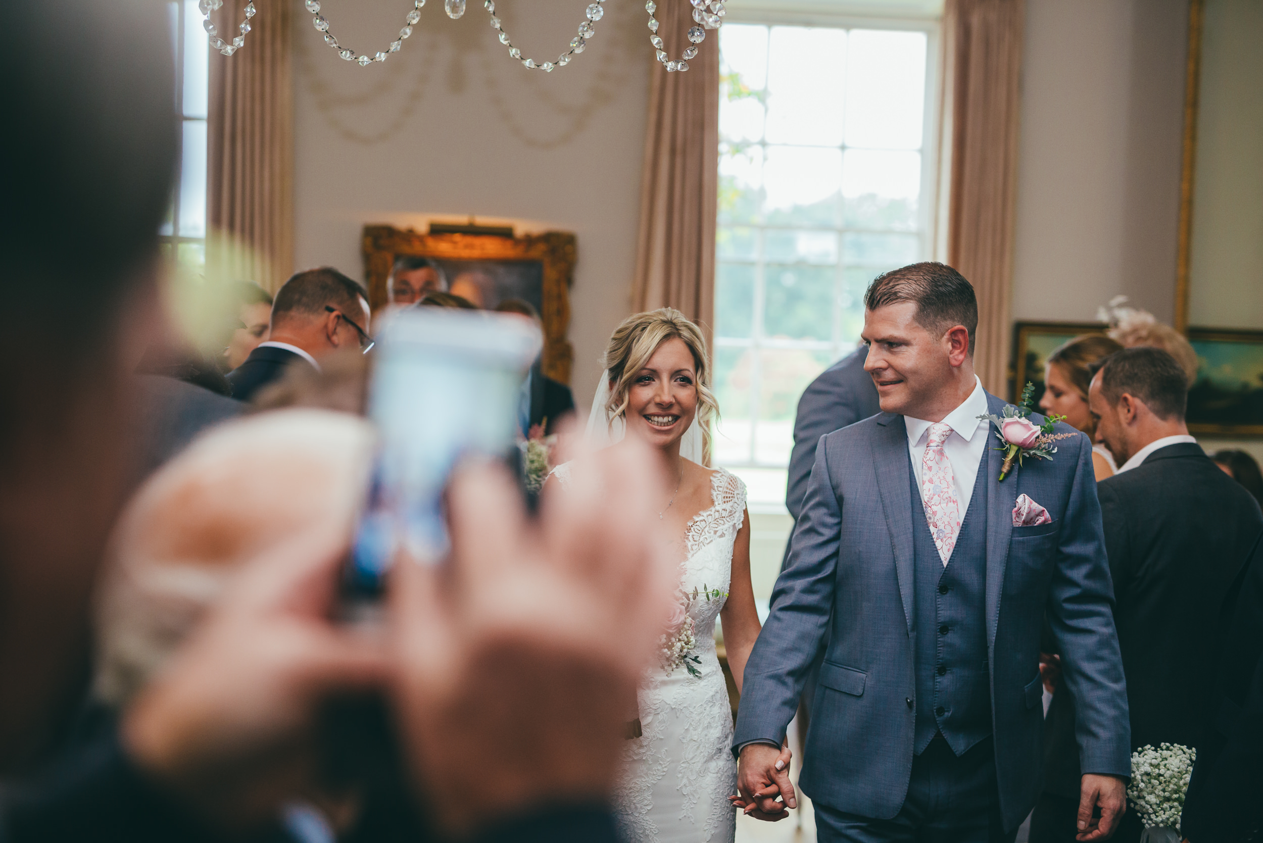 bride and groom walking down the aisle together