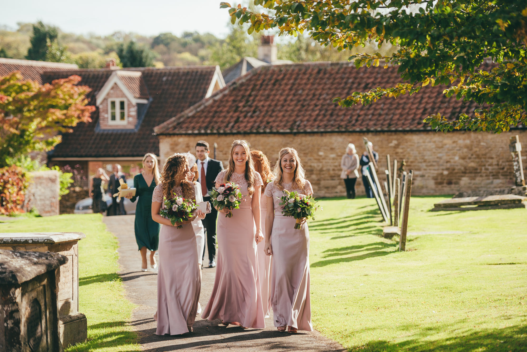 bridesmaids arriving at harlaxton manor church