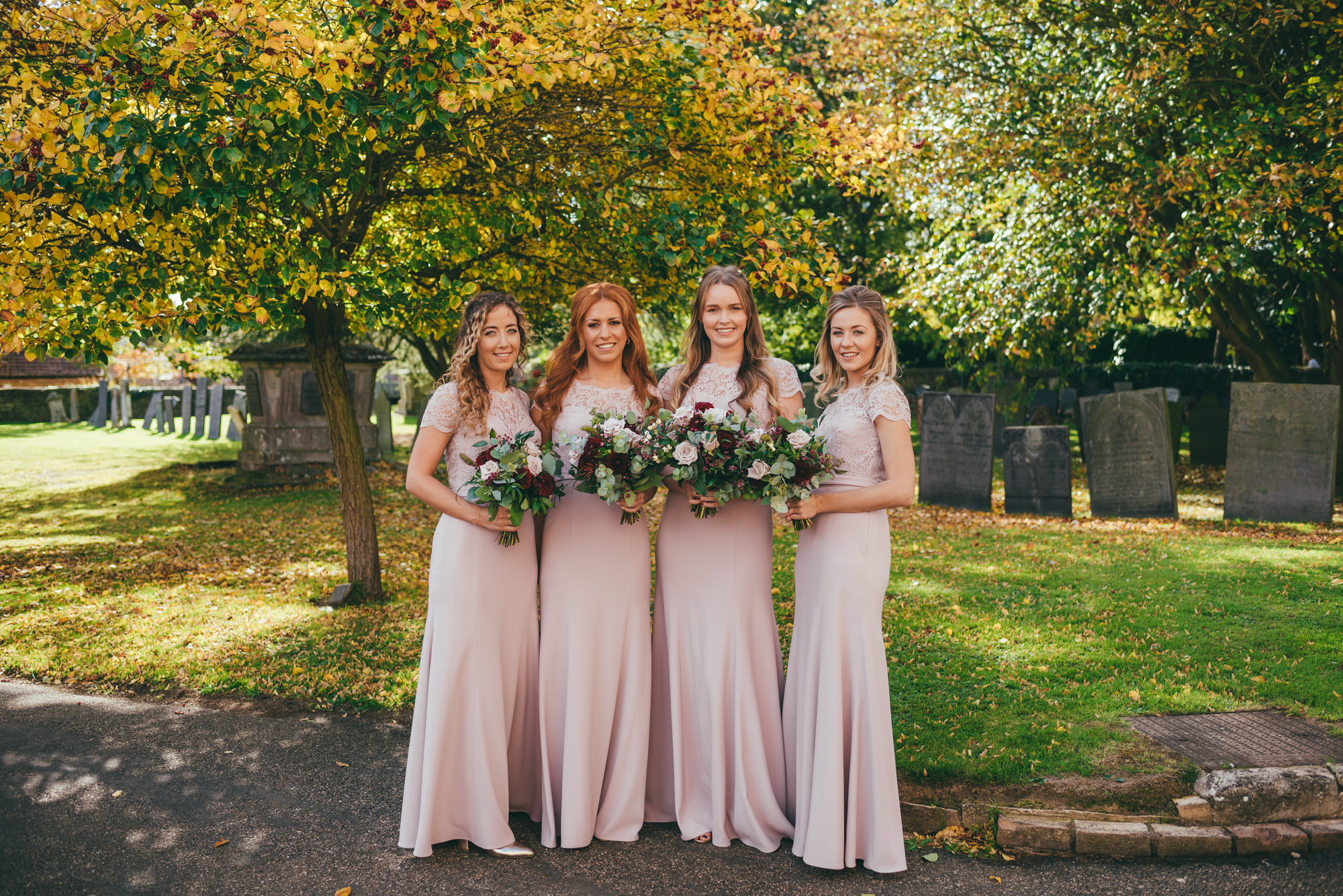 portrait of the bridesmaids at harlaxton church