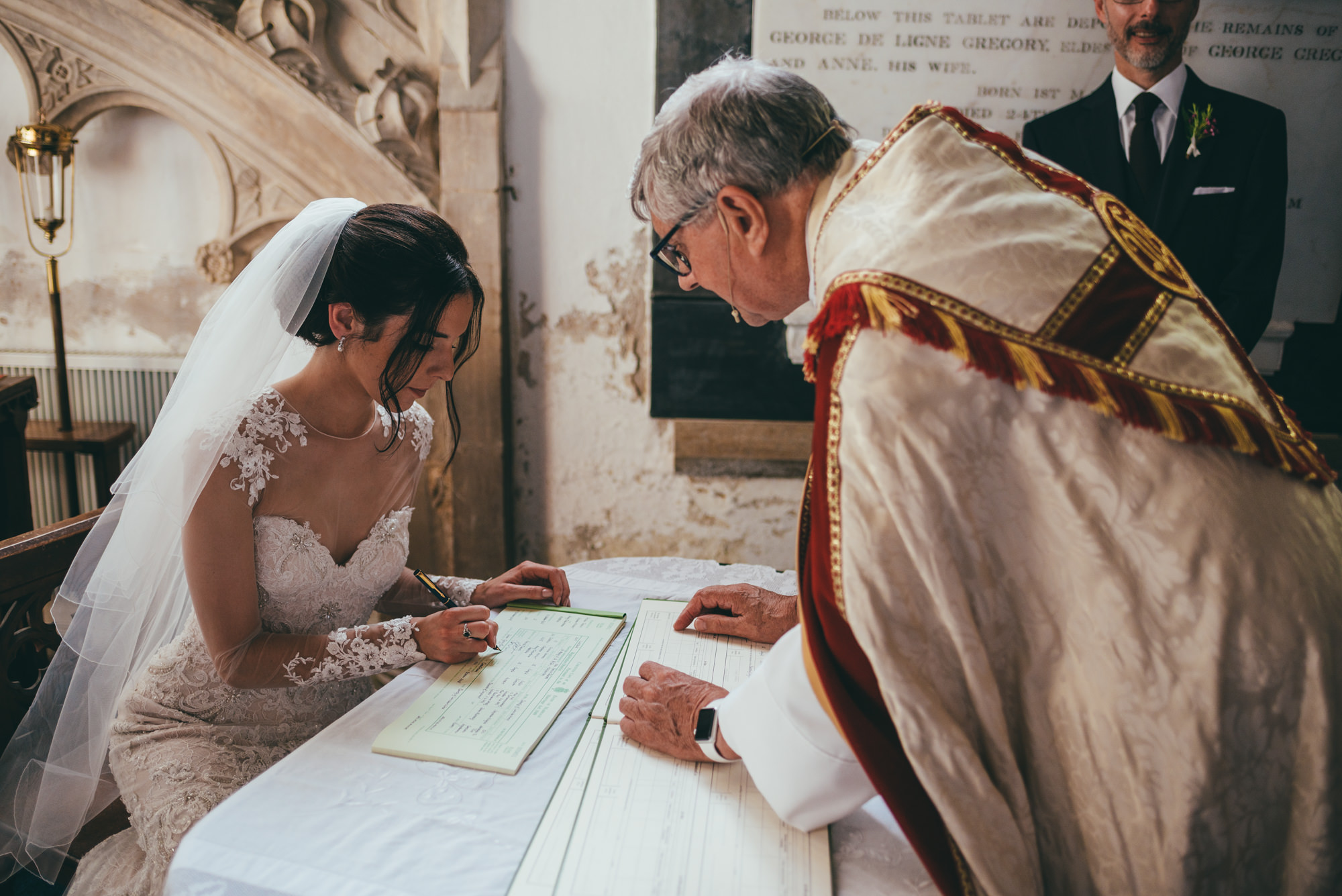bride signing the wedding register