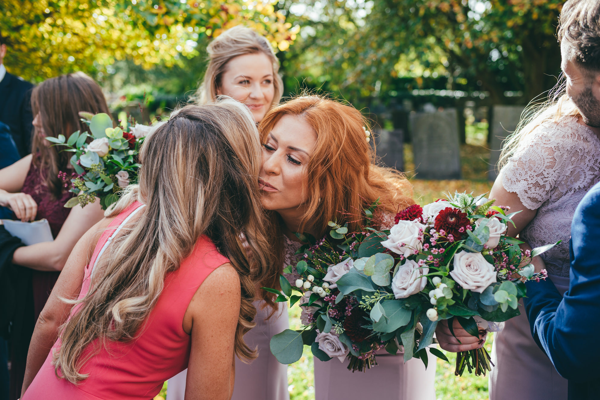 bridesmaid kissing her friend