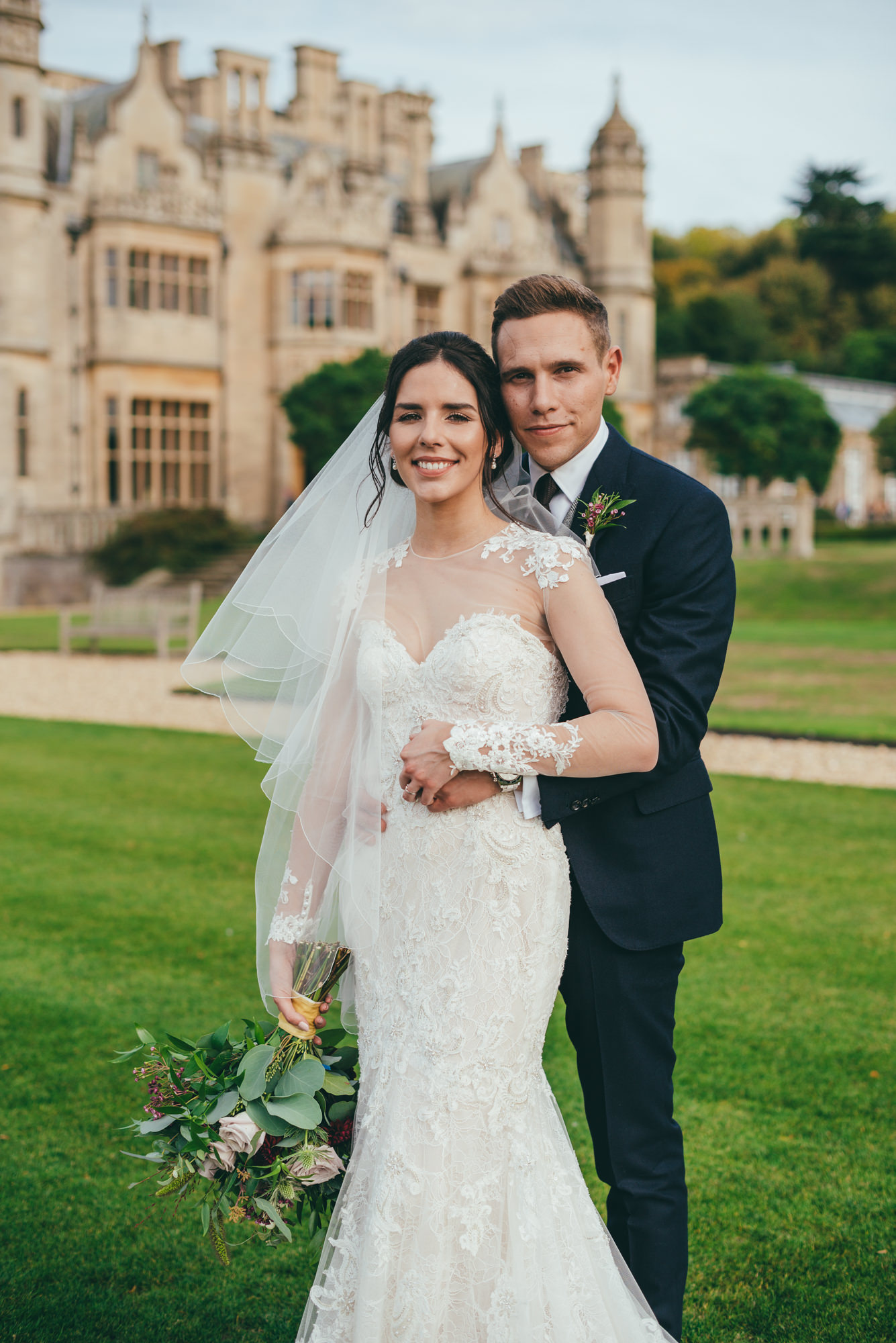 posed picture of the bride and groom at harlaxton manor