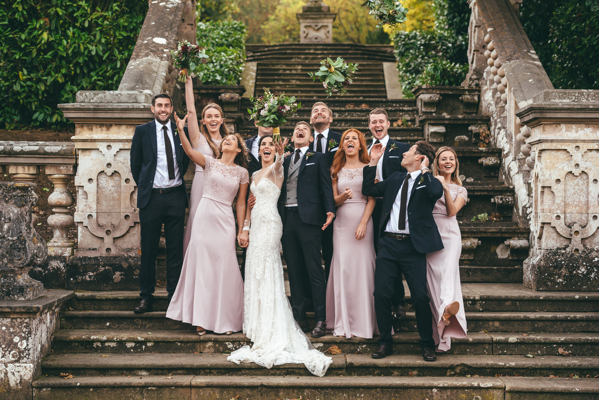 bridal party on the steps at harlaxton manor