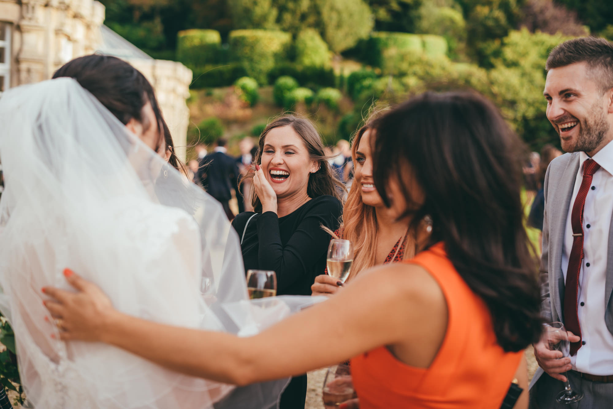 bride laughing with guests