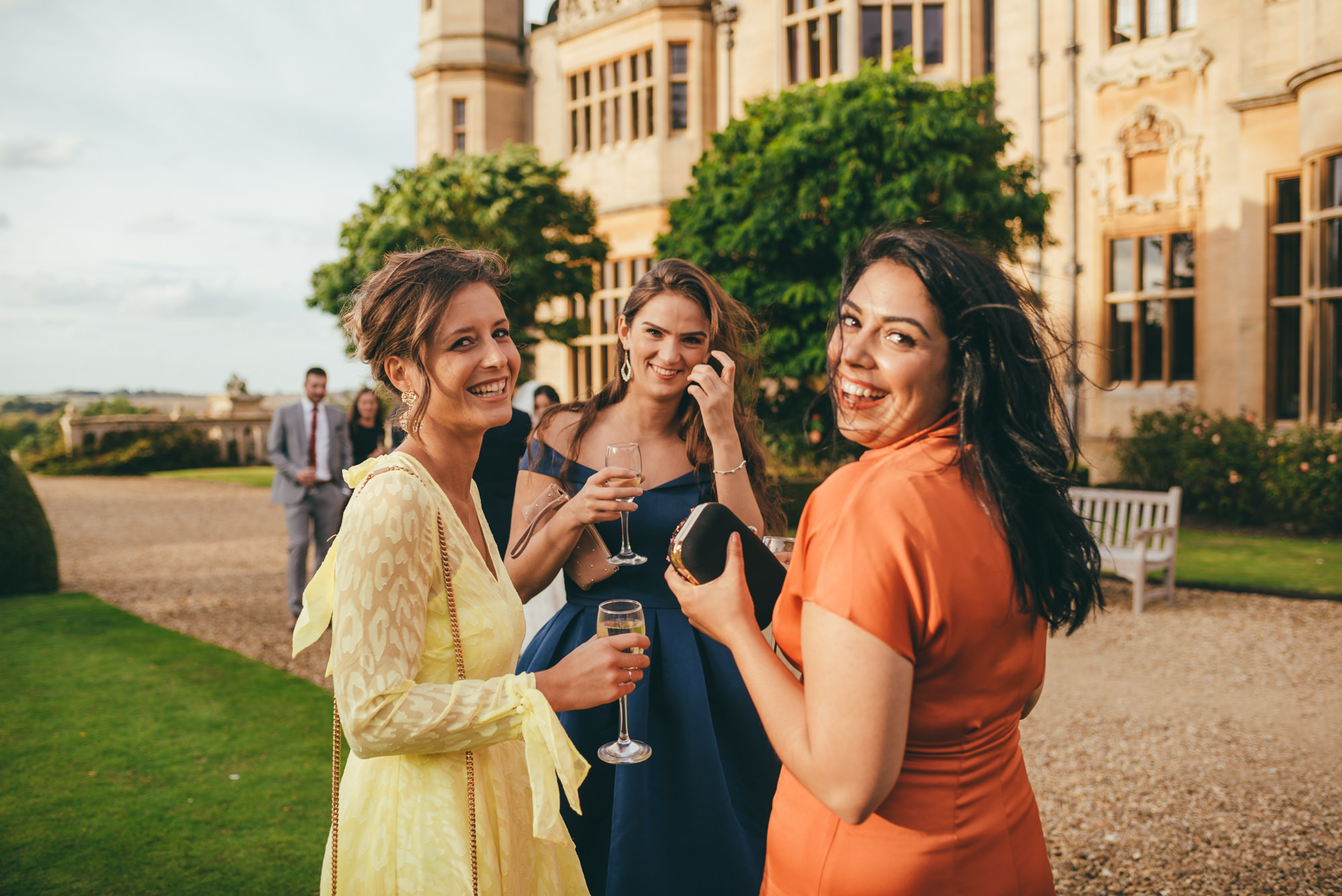 female wedding guests smiling