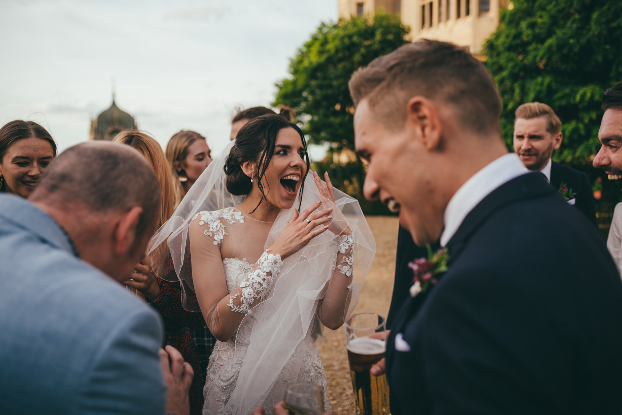 bride and groom amazed at card tricks with the magician