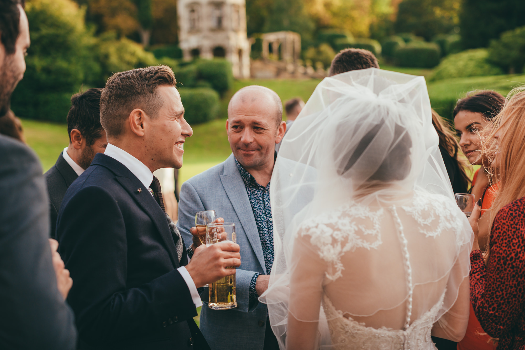 groom talking with the magician