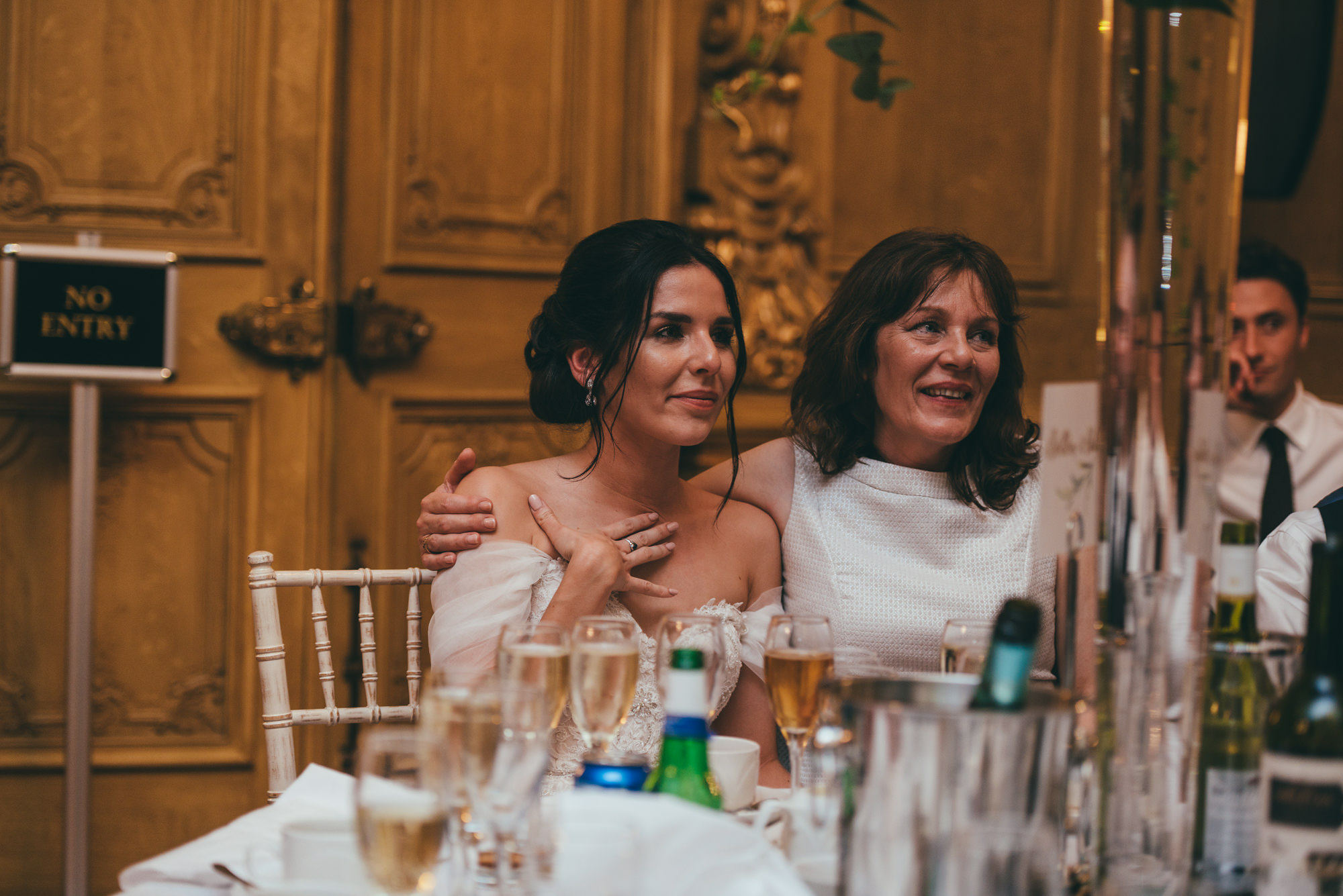 bride hugs her mother during the speeches