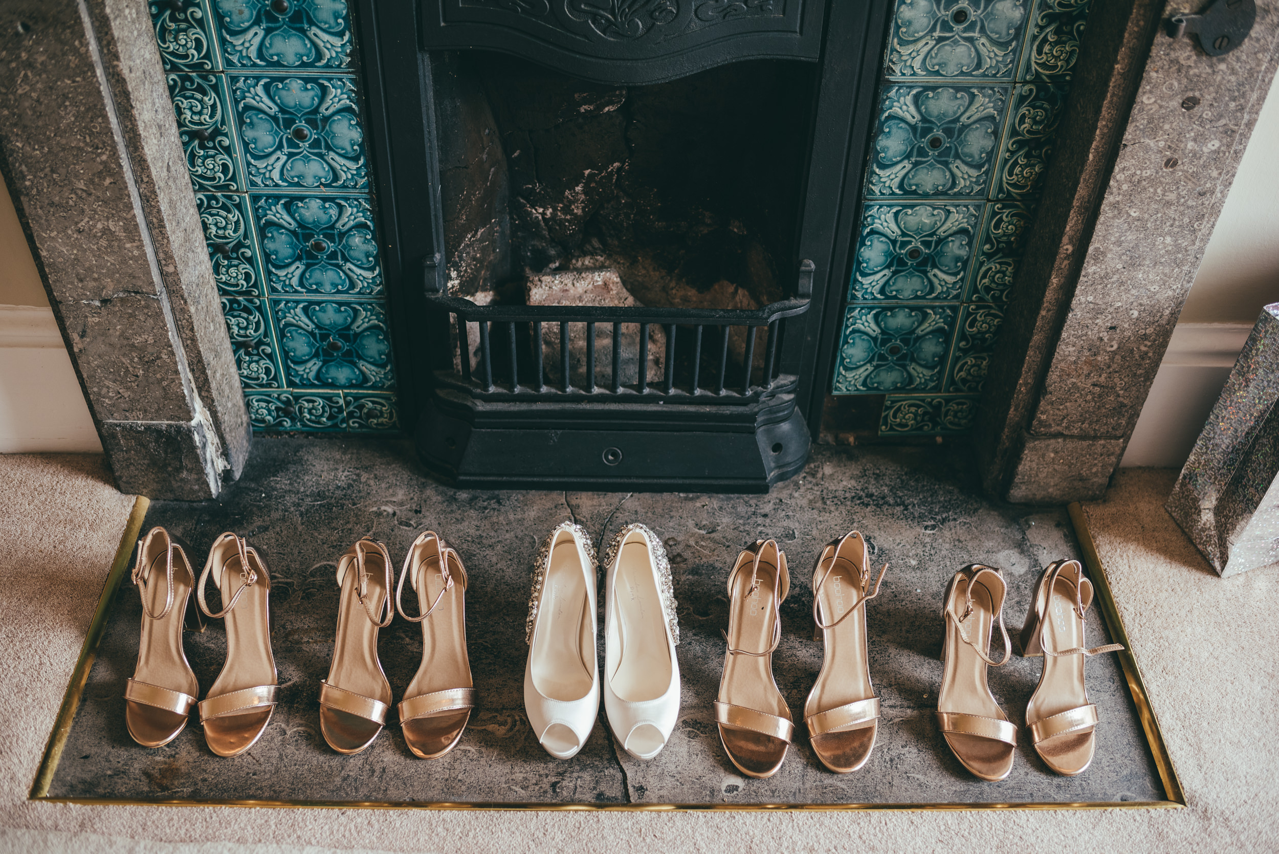 wedding shoes on a fireplace