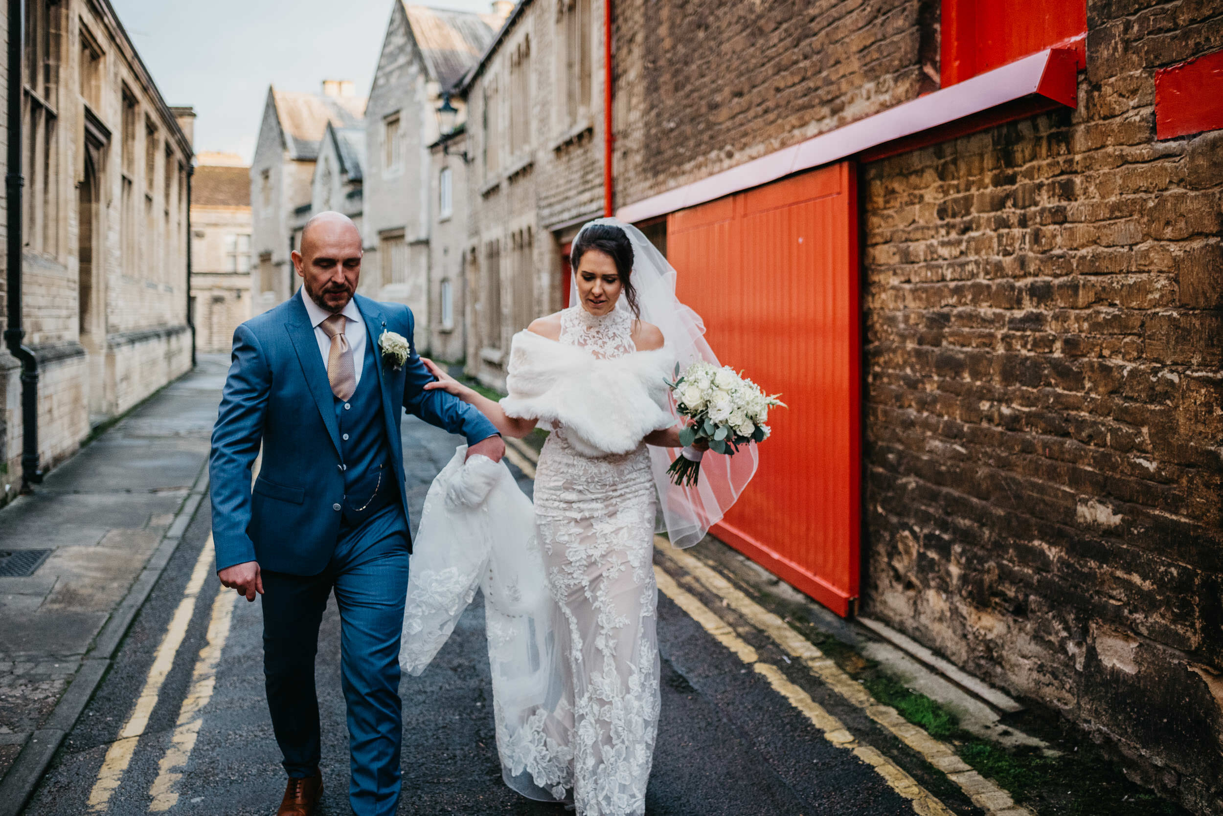 Bride and groom walking through the streets of Oundle