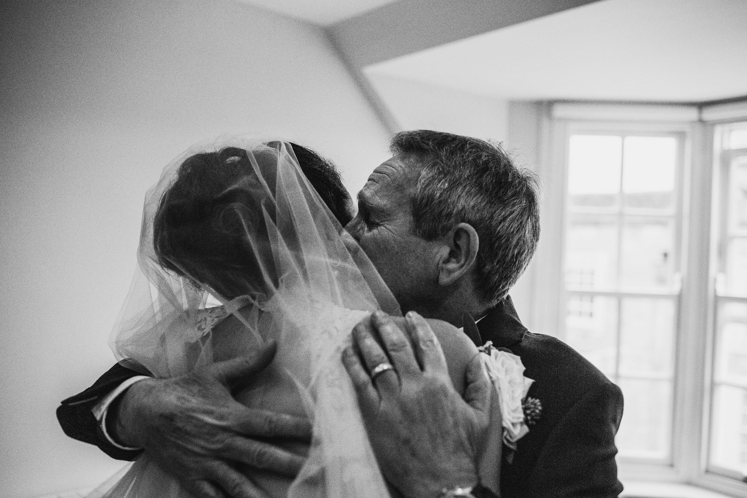 emotional hug from the father of the bride