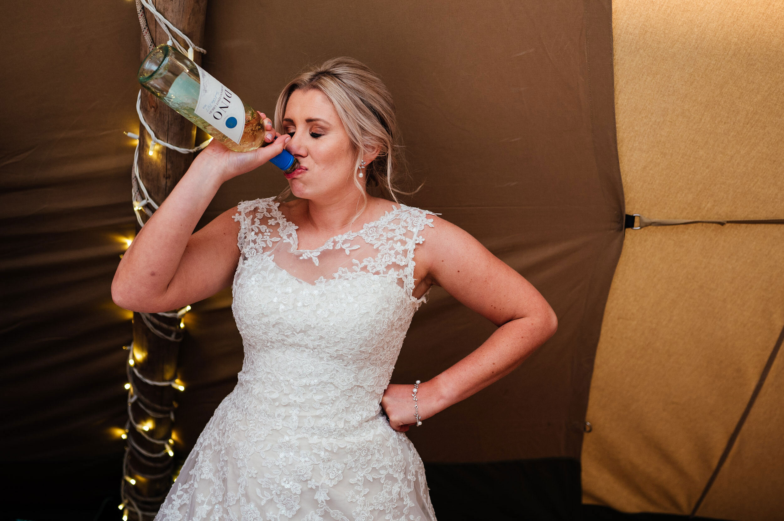 bride drinking from the bottle
