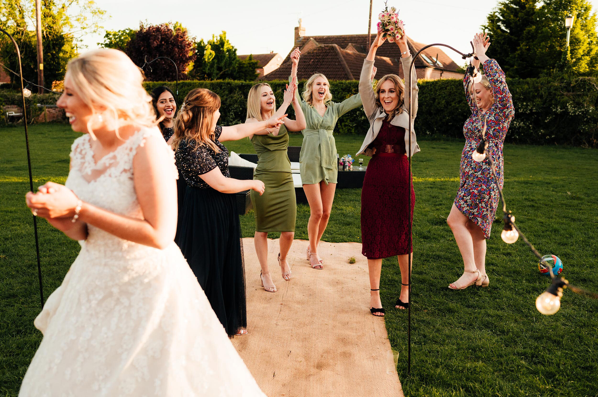 girl catches the bouquet toss