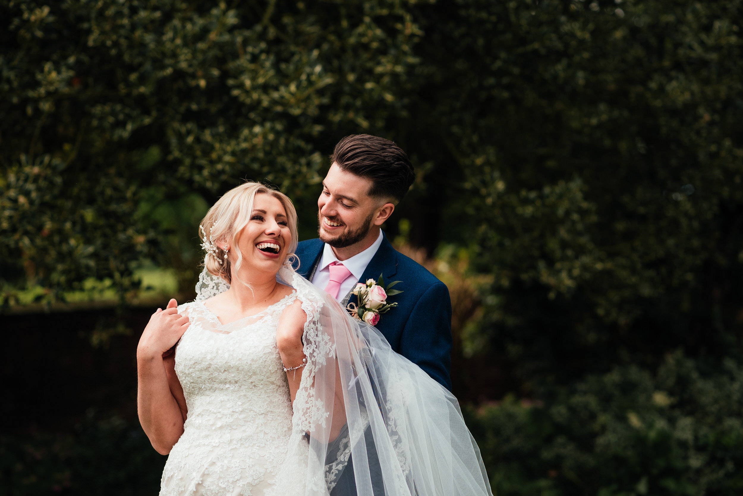 bride and groom sharing a joke