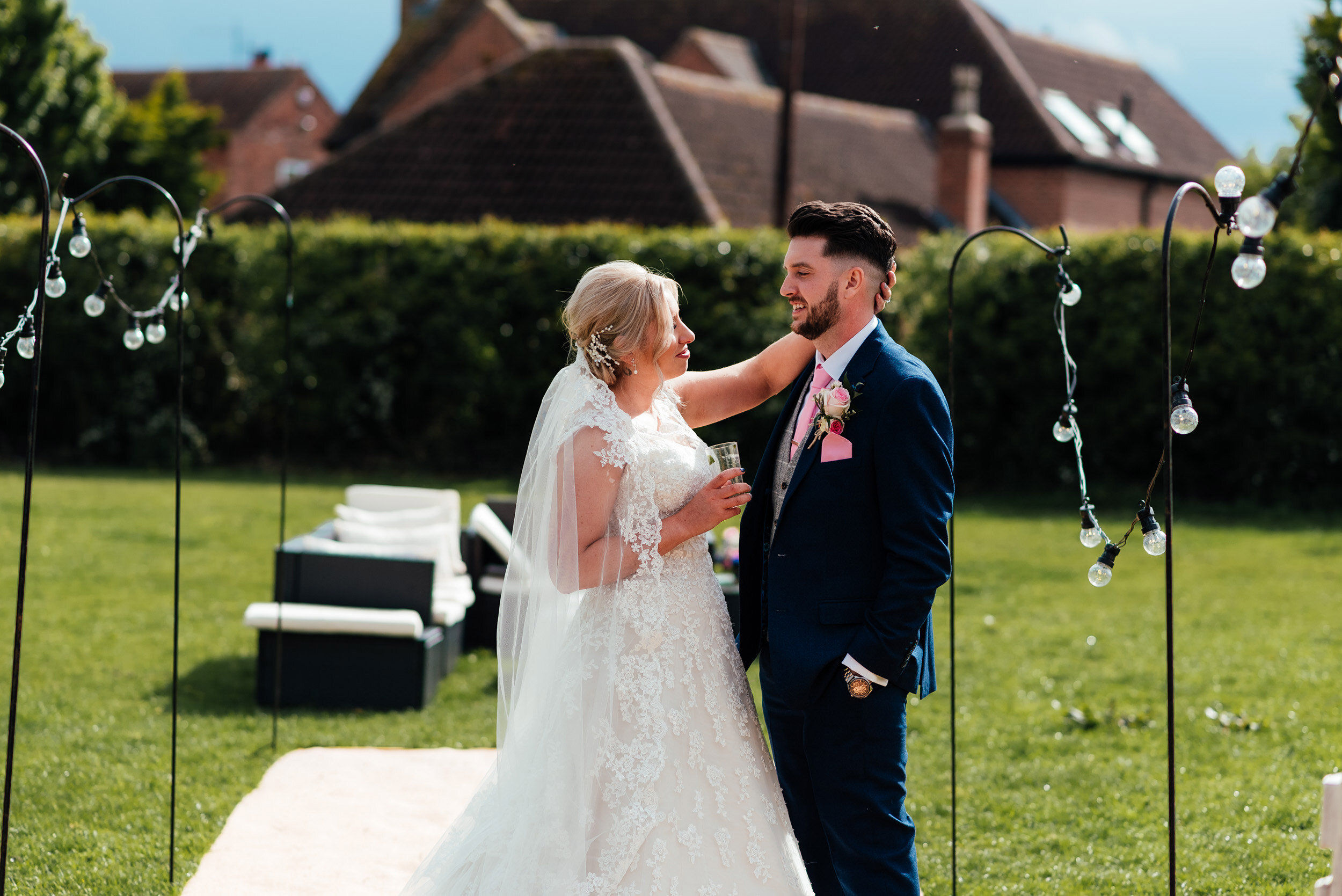 bride  strokes the grooms head