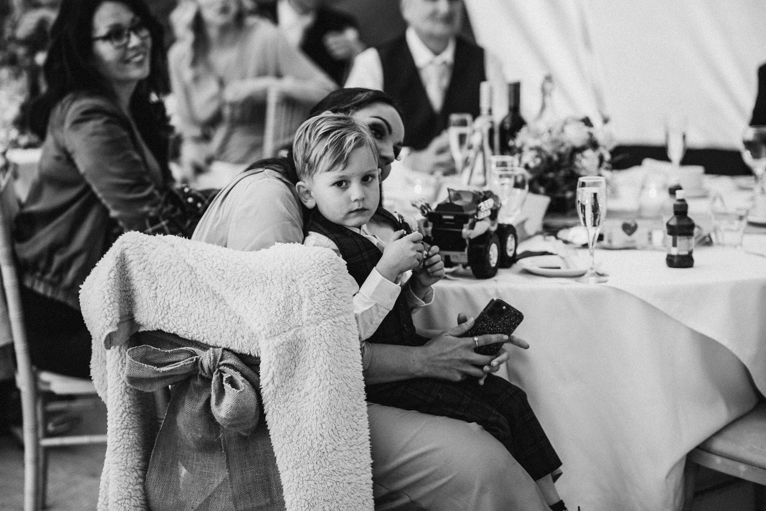 wedding guests listen to the wedding speeches