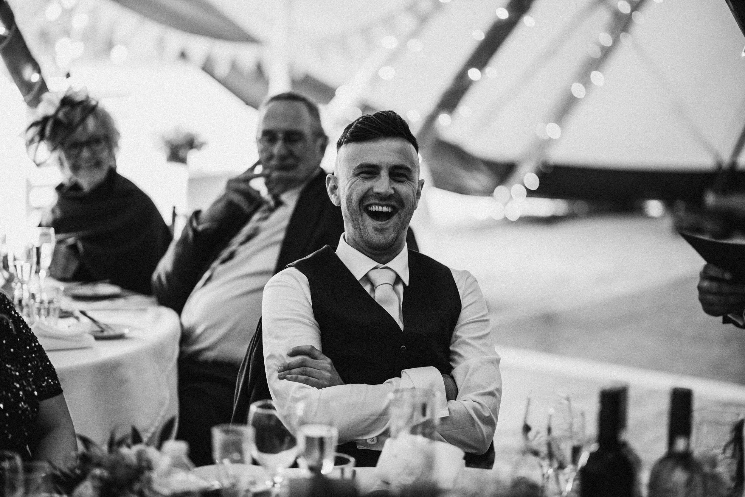 wedding guests laughs a the speeches