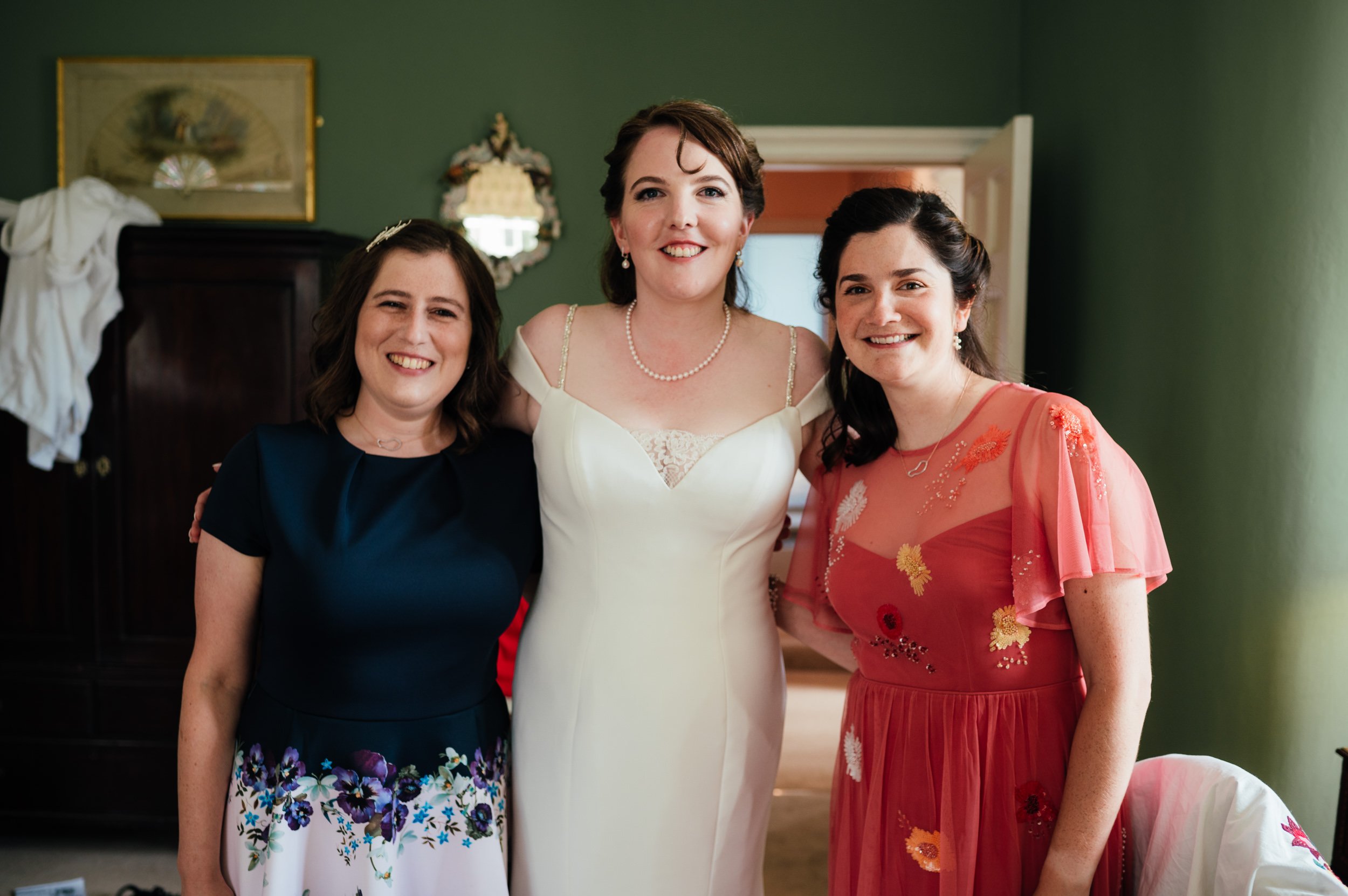 picture of the bride with two bridesmaids