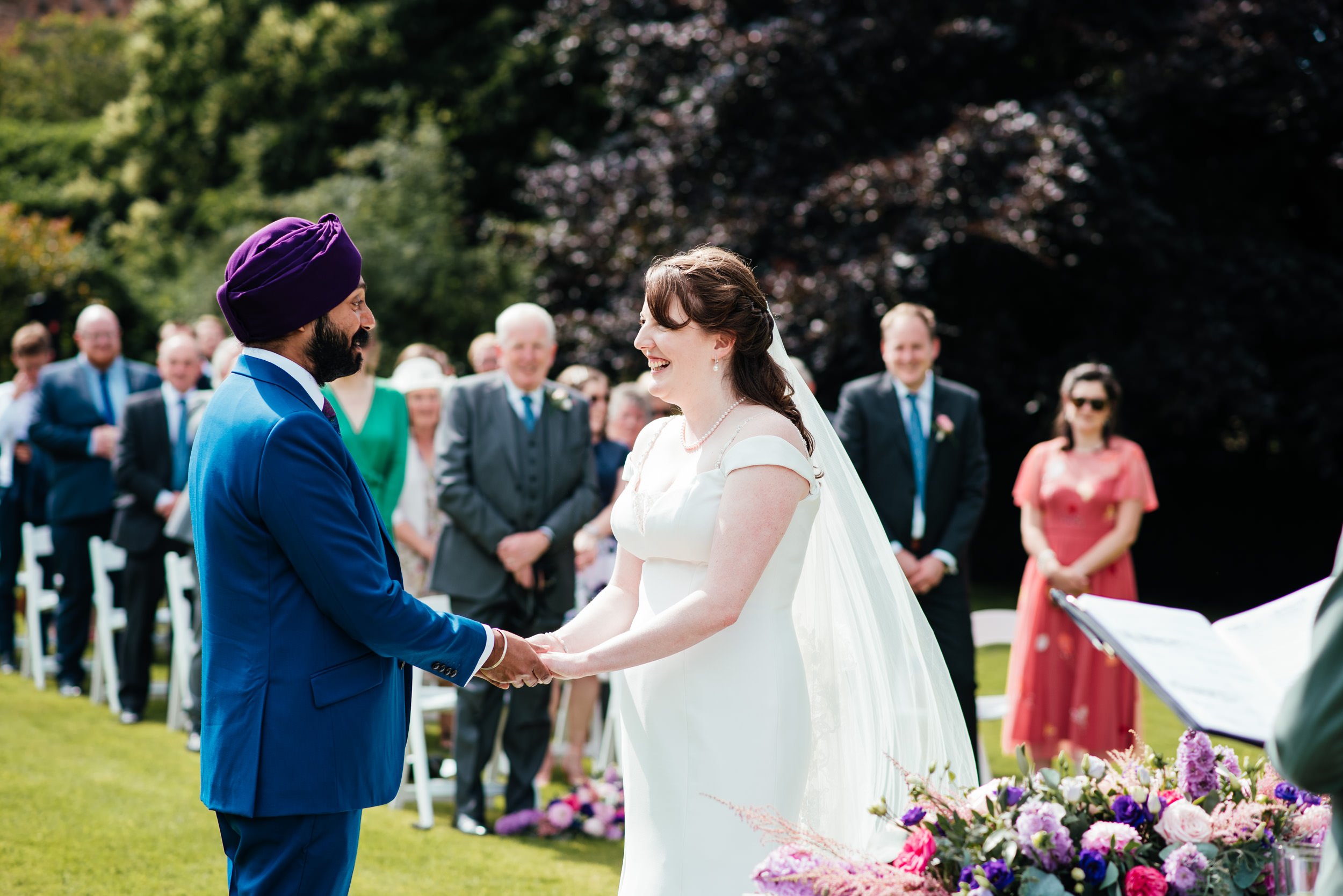 bride and groom holding hands