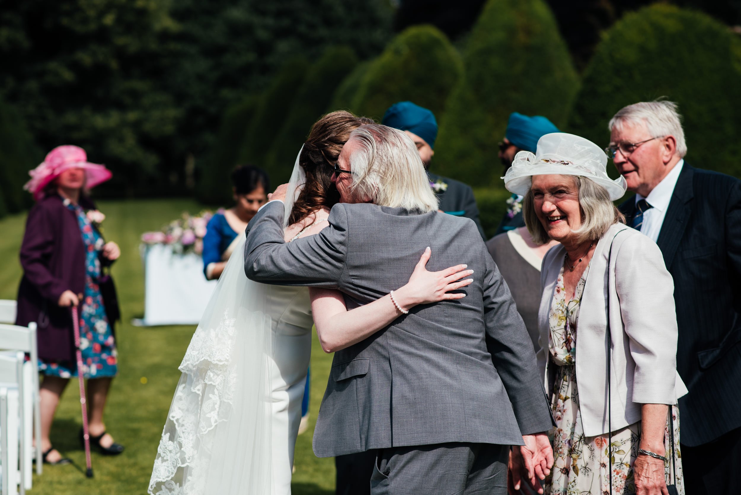 bride hugs grandparent