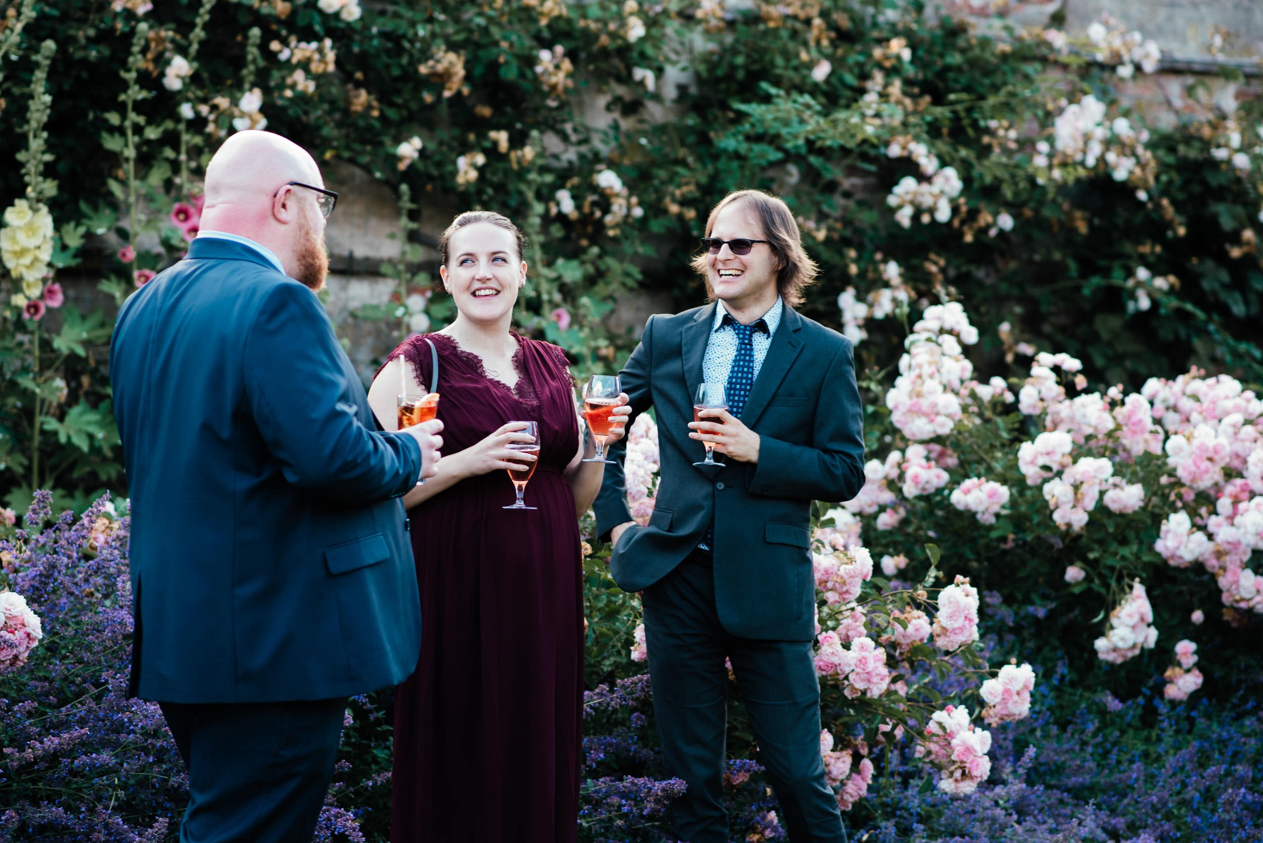 guests share a joke at the reception venue