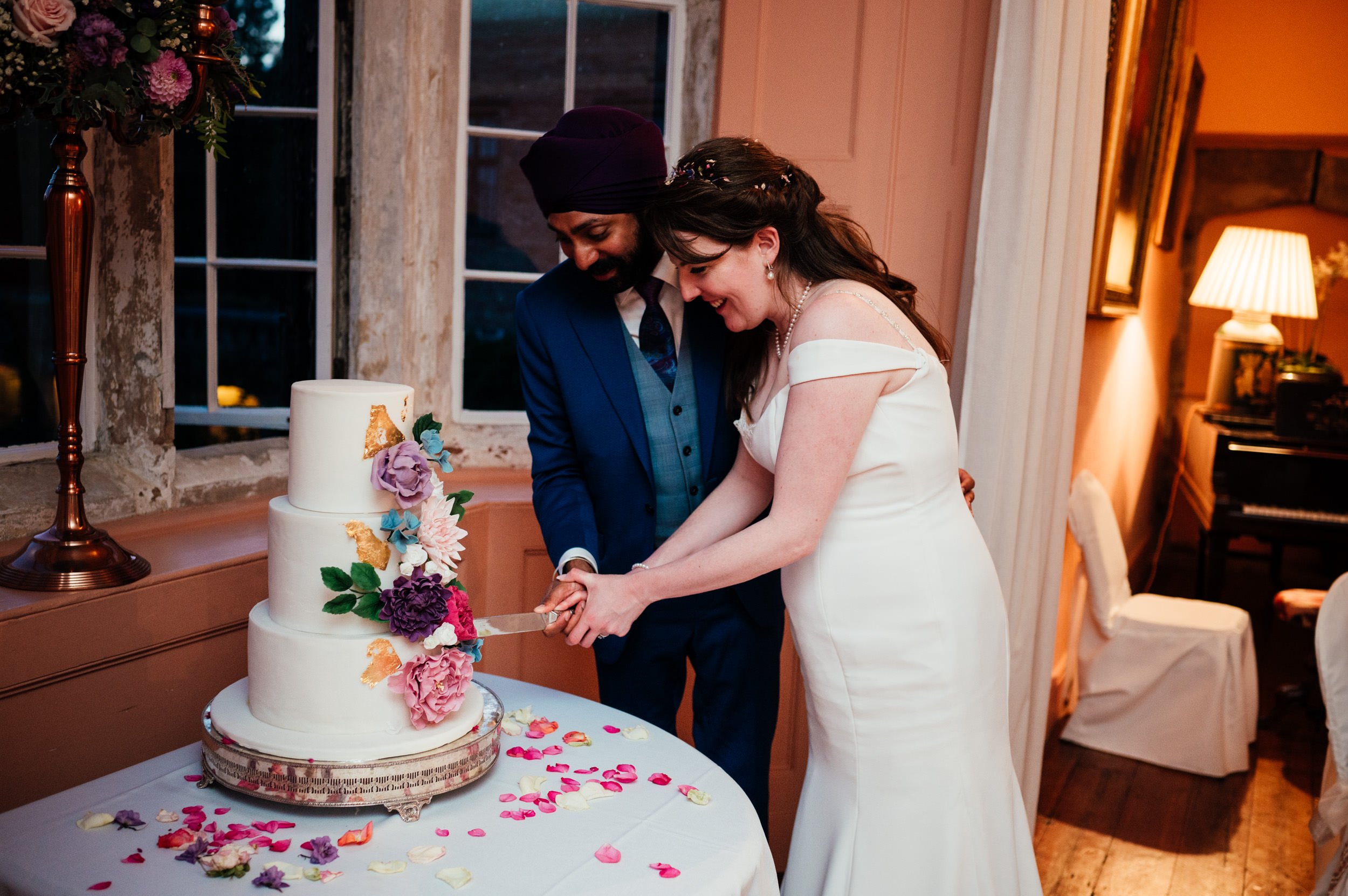 bride and groom cut the cake