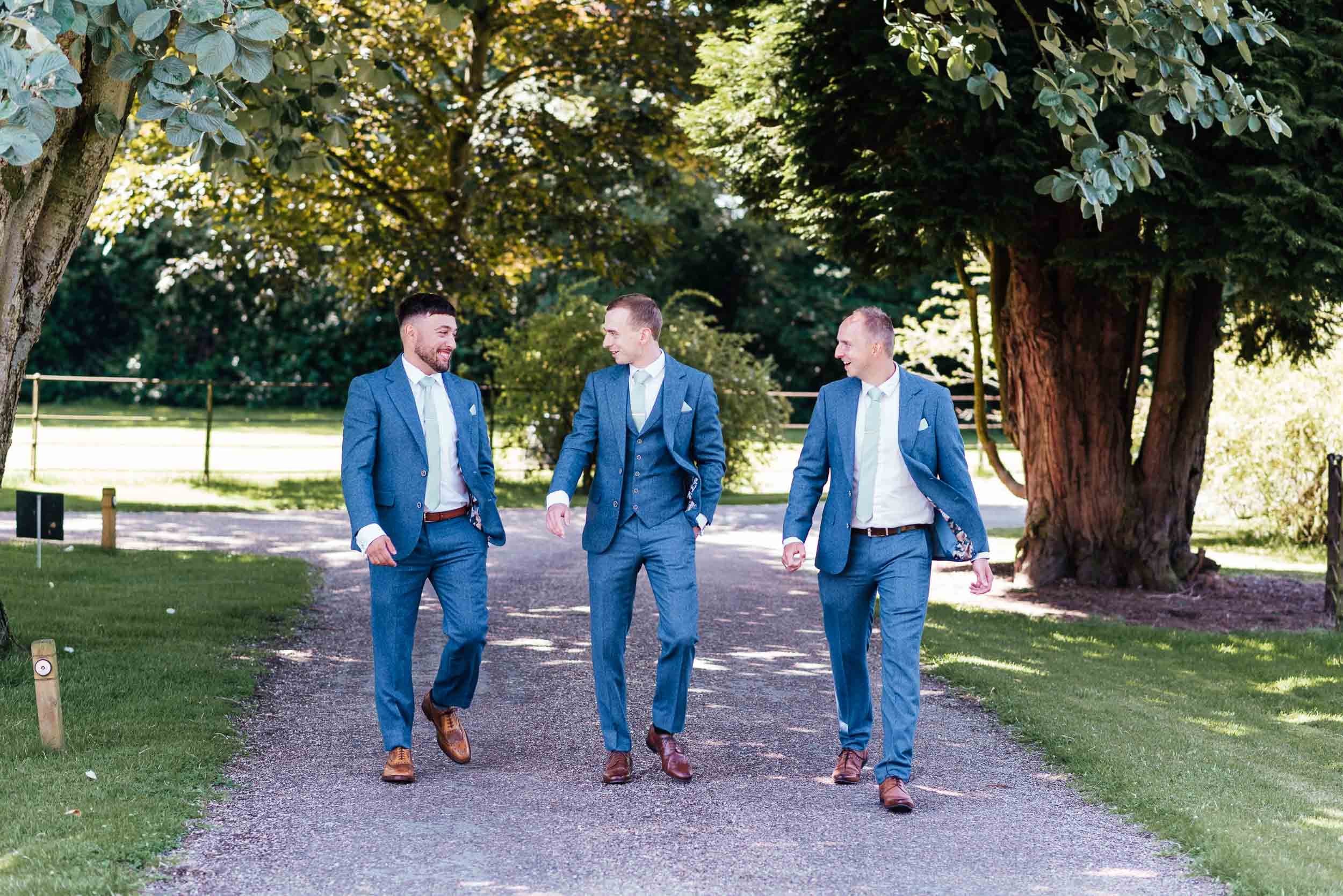 groomsmen walking to the ceremony