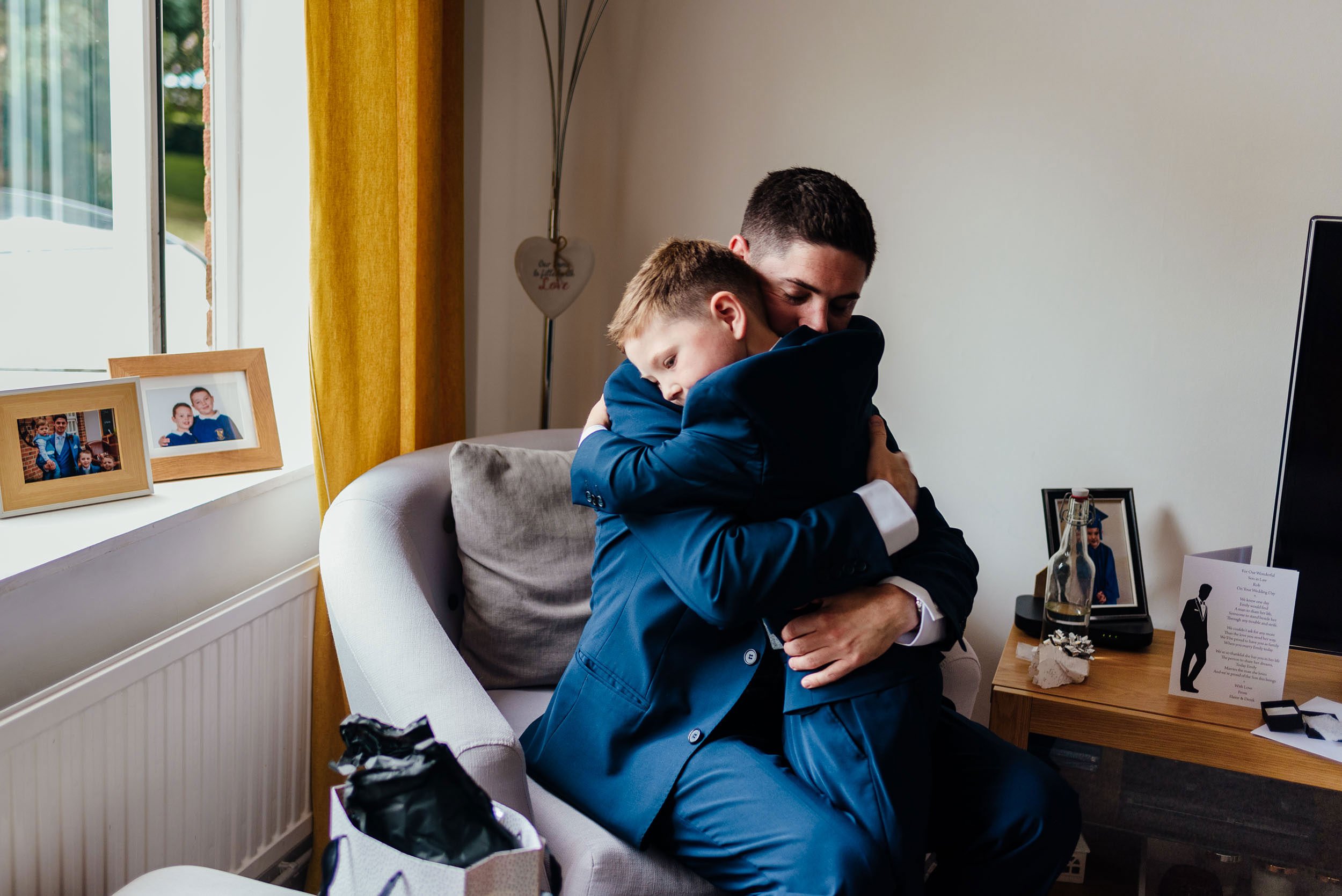 groom and son hugging