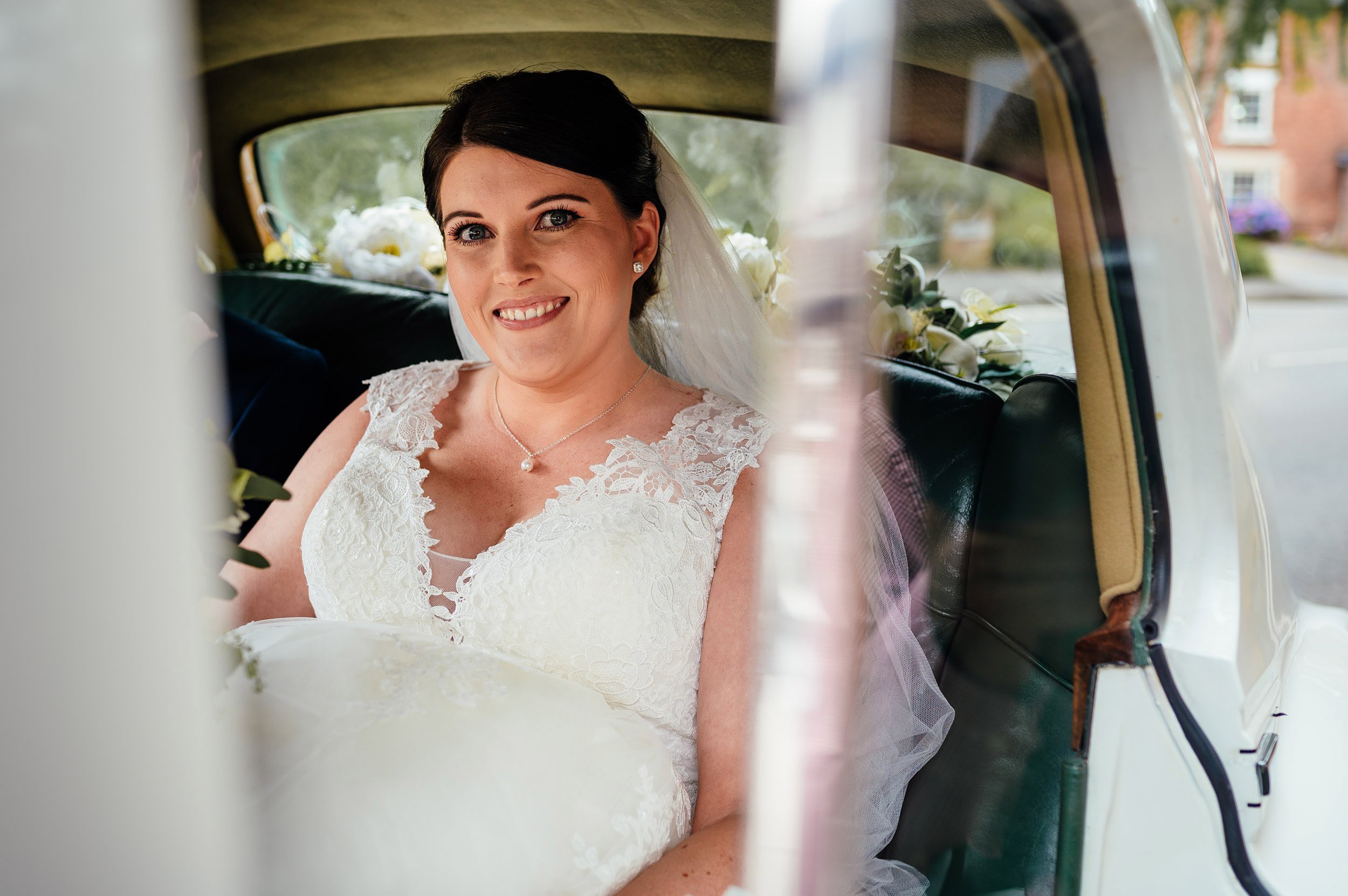 bride arrives at church in her wedding car