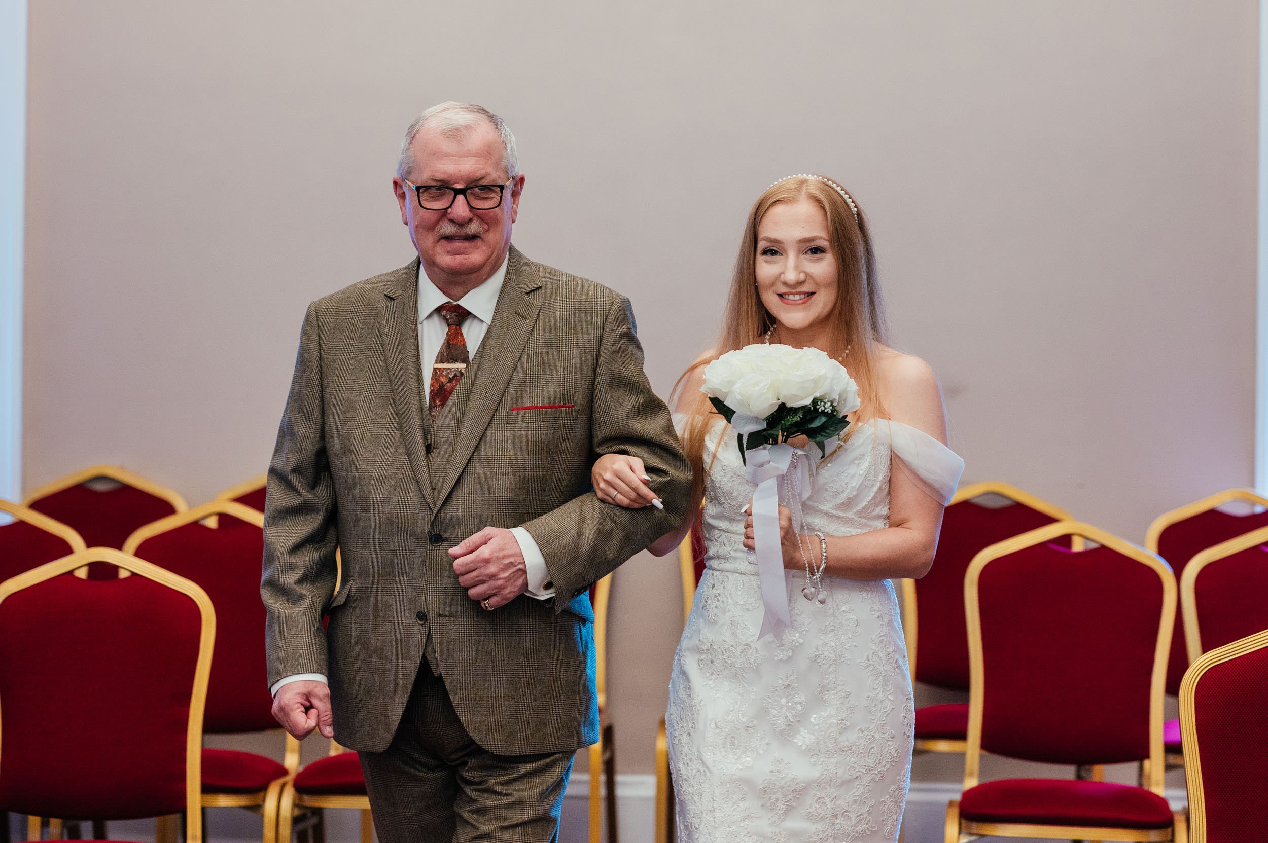 bride and father walking down the aisle at bridgford hall