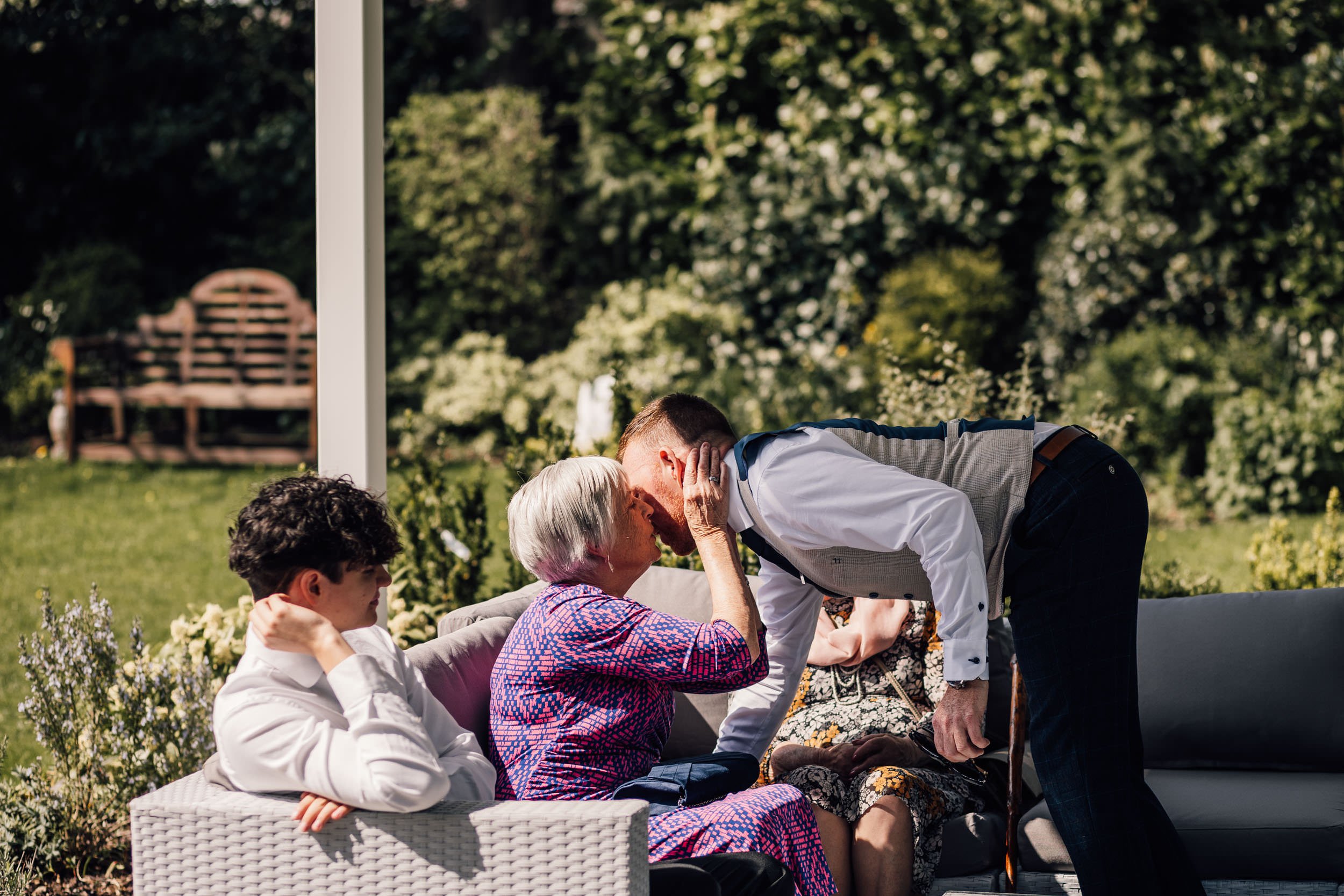 groom kissing grandma