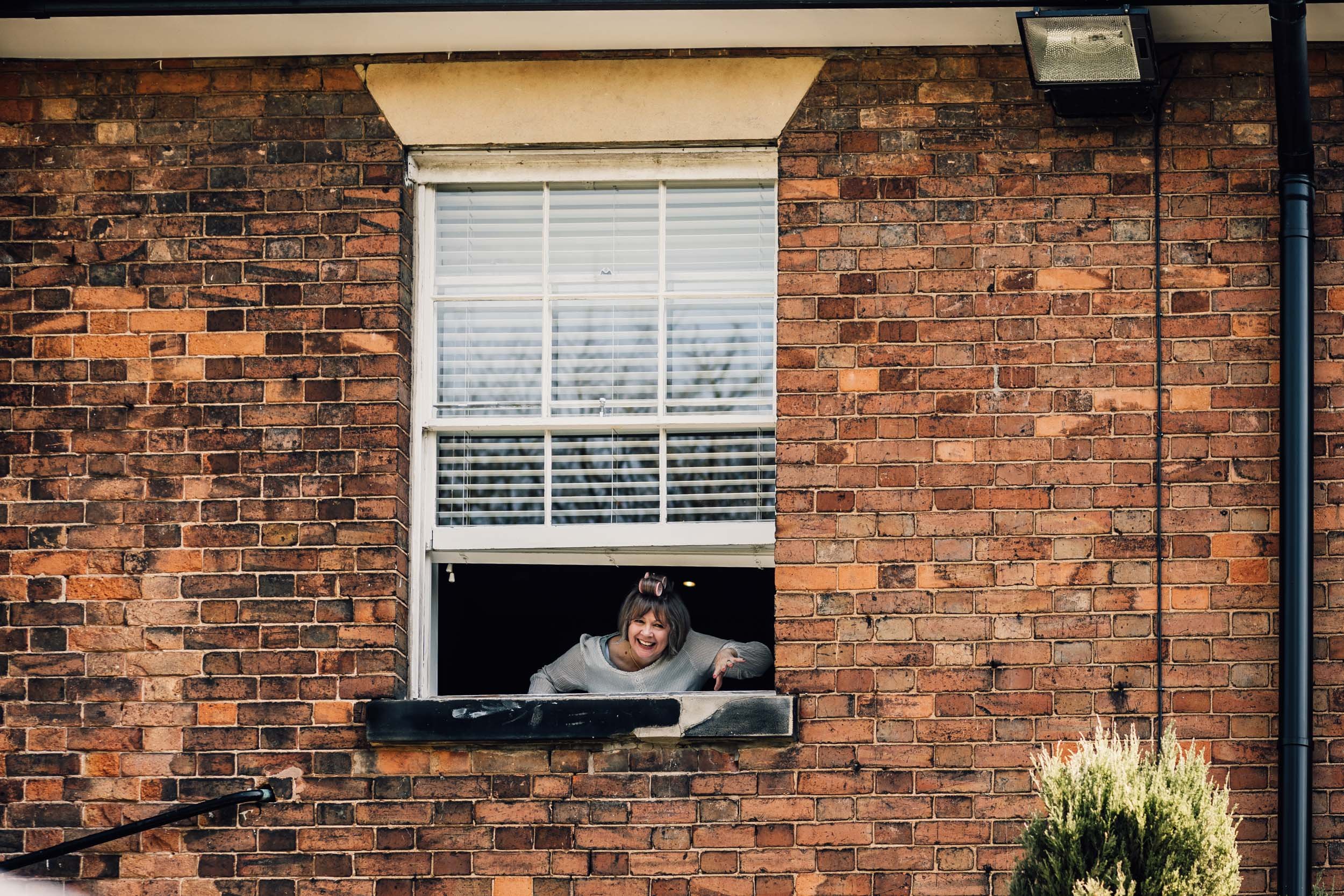 wedding guest shouting out of the window